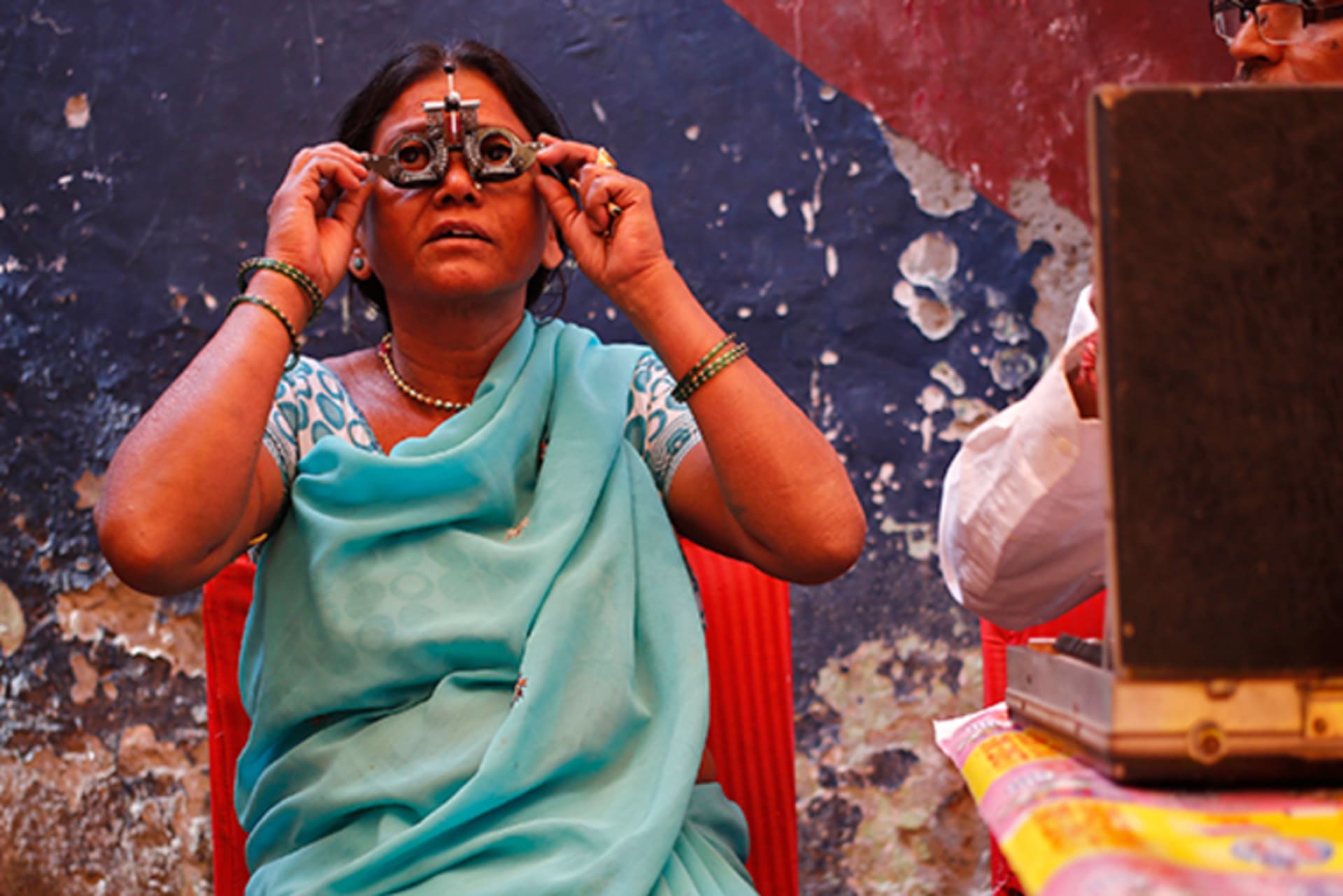 A woman undergoes an eye examination at a camp organised by a non-governmental organisation (NGO) in New Delhi November 18, 2013.