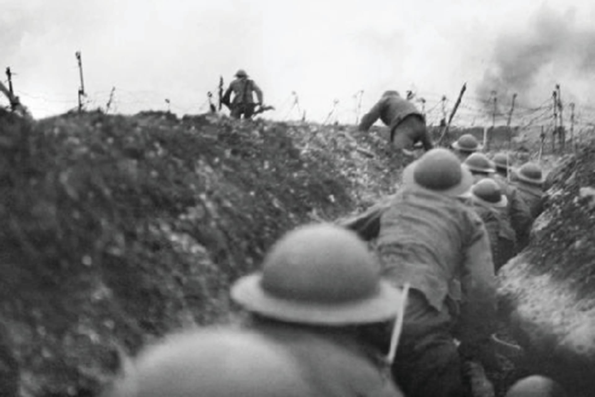Soldiers moving through a trench in World War One