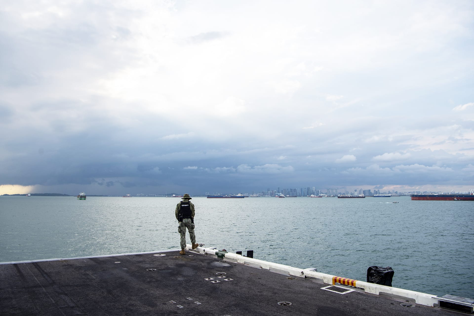 <p>Master-at-Arms third Class Elisha Francois stands watch as the Nimitz-class aircraft carrier transits the Strait of Malacca, December 28, 2024.</p>
