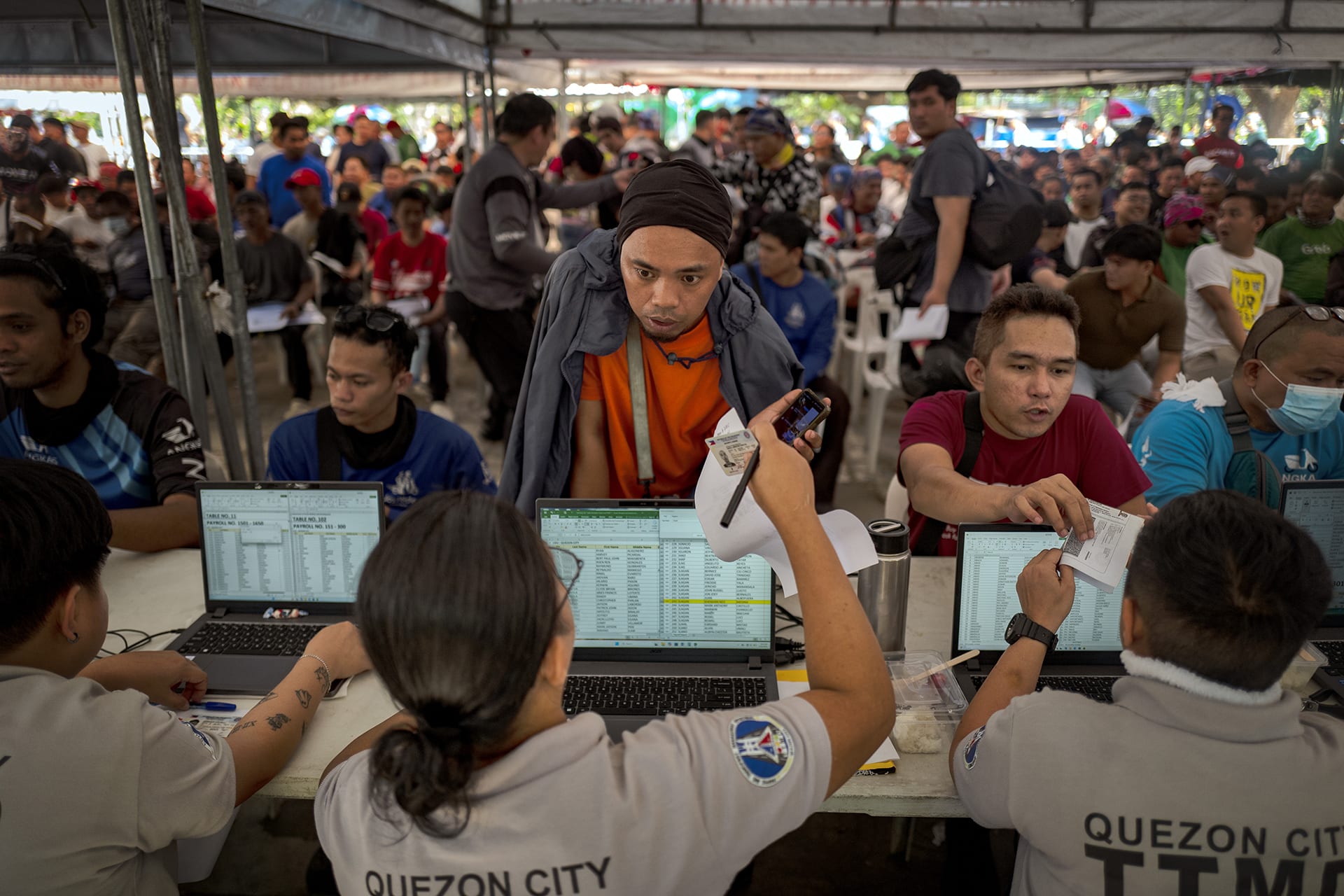 <p>App-based motorcycle drivers queue to receive cash aid amid surging fuel costs on March 26, 2026, in Quezon City, Metro Manila, Philippines.</p>