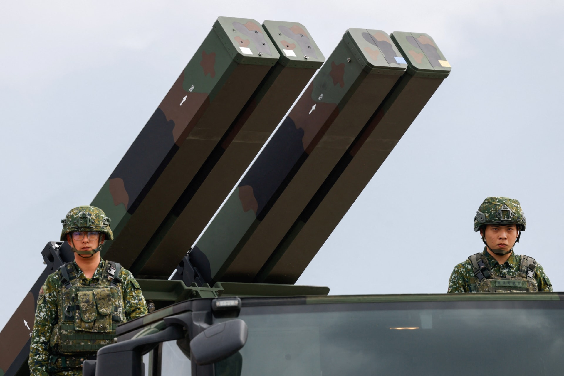 Taiwanese soldiers stand next to a Sky Sword II surface-to-air missile launcher during an annual military exercise ahead of Lunar New Year in Taichung