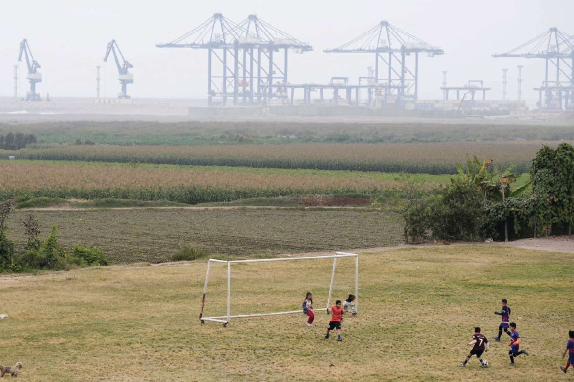 Children play football near the new megaport being built by China's state-owned Cosco Shipping in Chancay, Peru October 24, 2024.