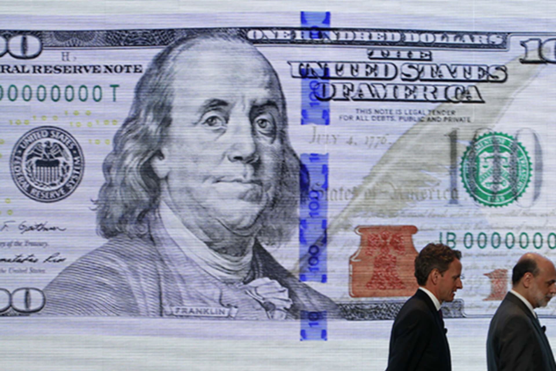 From left, U.S. Treasury Secretary Timothy Geithner and Federal Reserve Chairman Ben Bernanke leave a ceremony to debut the new design for the U.S. $100 bill at the Department of the Treasury in Washington on April 21, 2010.
