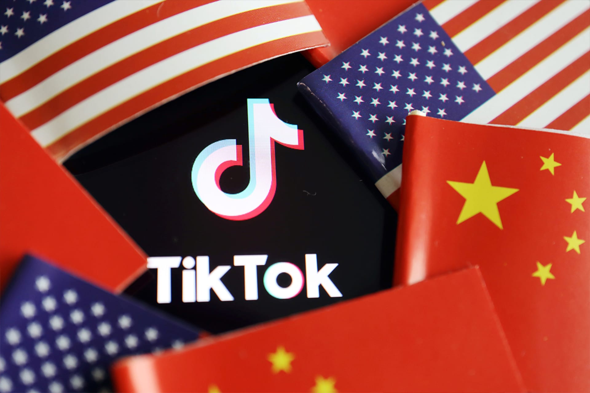 <p>China and U.S. flags are seen near a TikTok logo in this illustration picture taken July 16, 2020.</p>