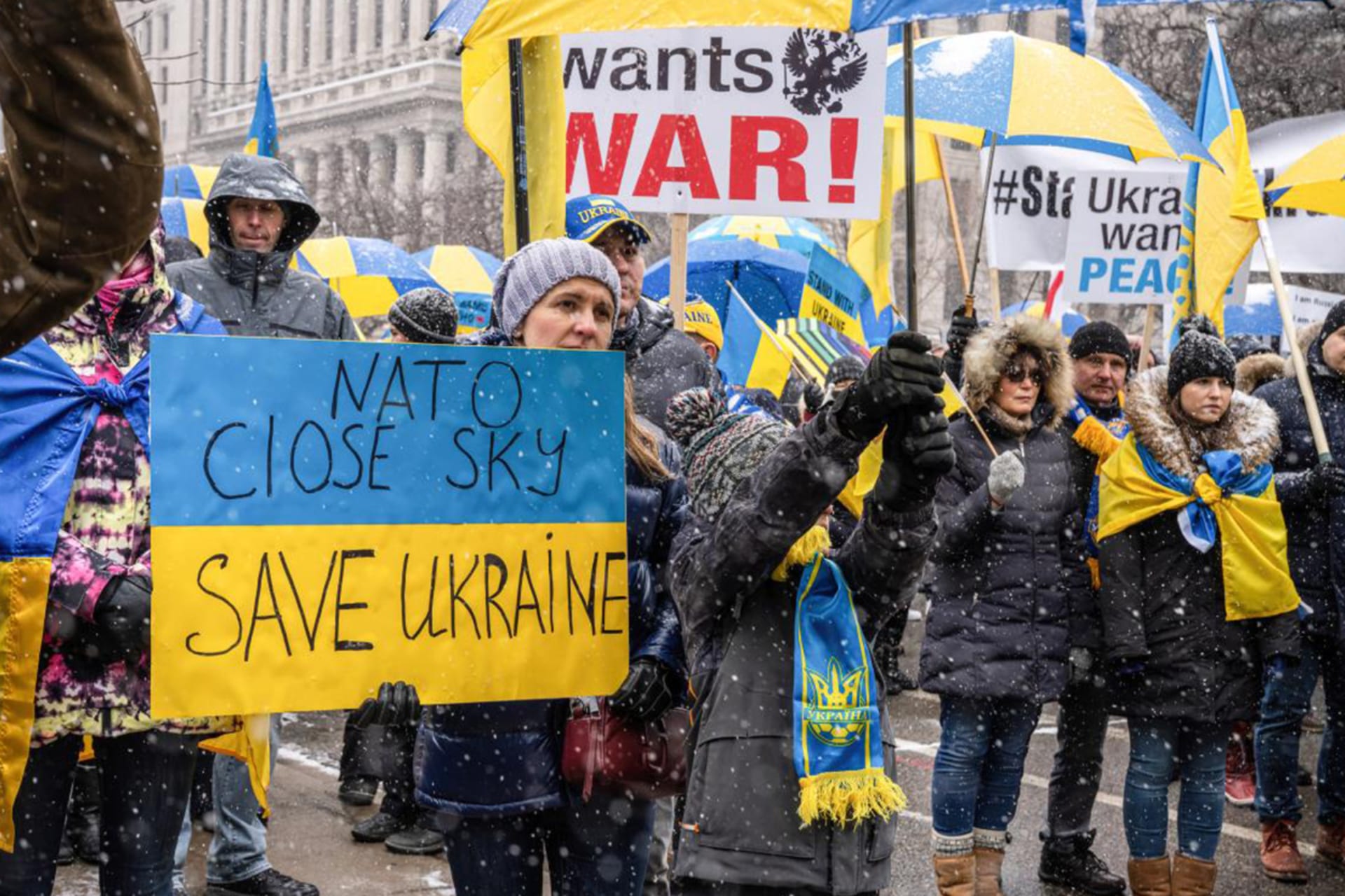 Protesters rally outside the U.S. Consulate in Toronto, Canada, calling for a "No Fly Zone" in support of Ukraine following Russia's invasion of the country.