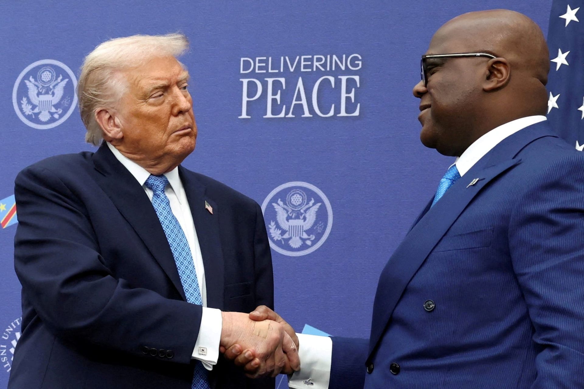 President Donald Trump shakes hands with President Felix Tshisekedi during a signing ceremony in Washington, D.C. on December 4, 2025.