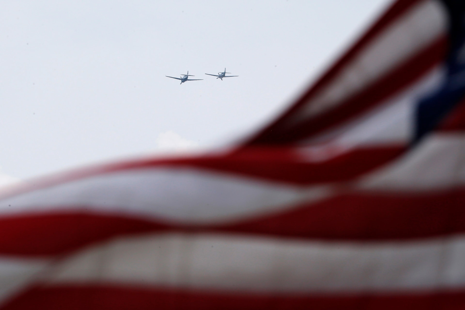 World War II era planes fly over U.S. flag during ceremony to commemorate the 70th anniversary of VE Day in Washington.