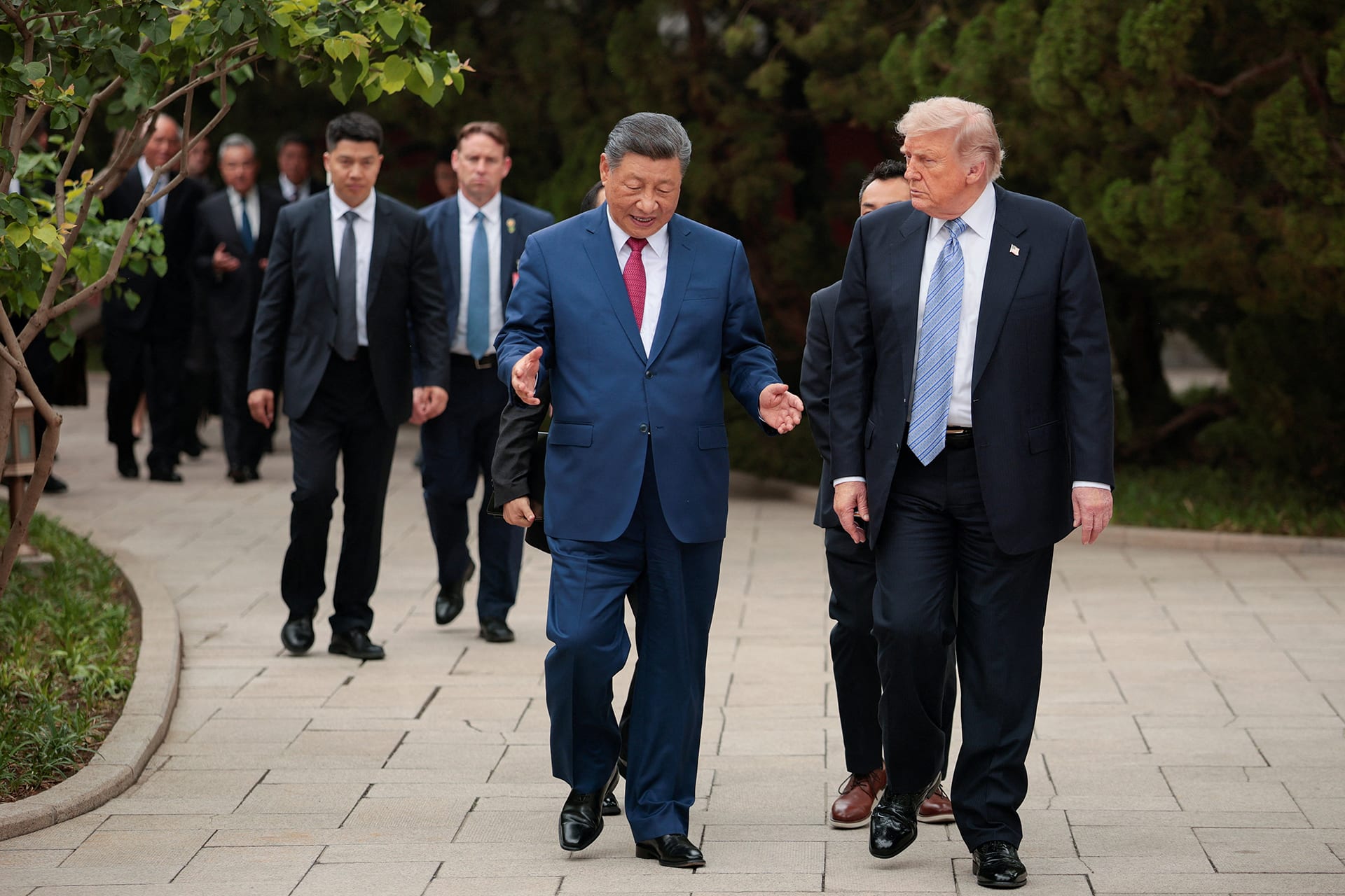 <p>U.S. President Donald Trump walks with Chinese President Xi Jinping while leaving after a visit to the Zhongnanhai Garden in Beijing, China, May 15, 2026. R</p>
