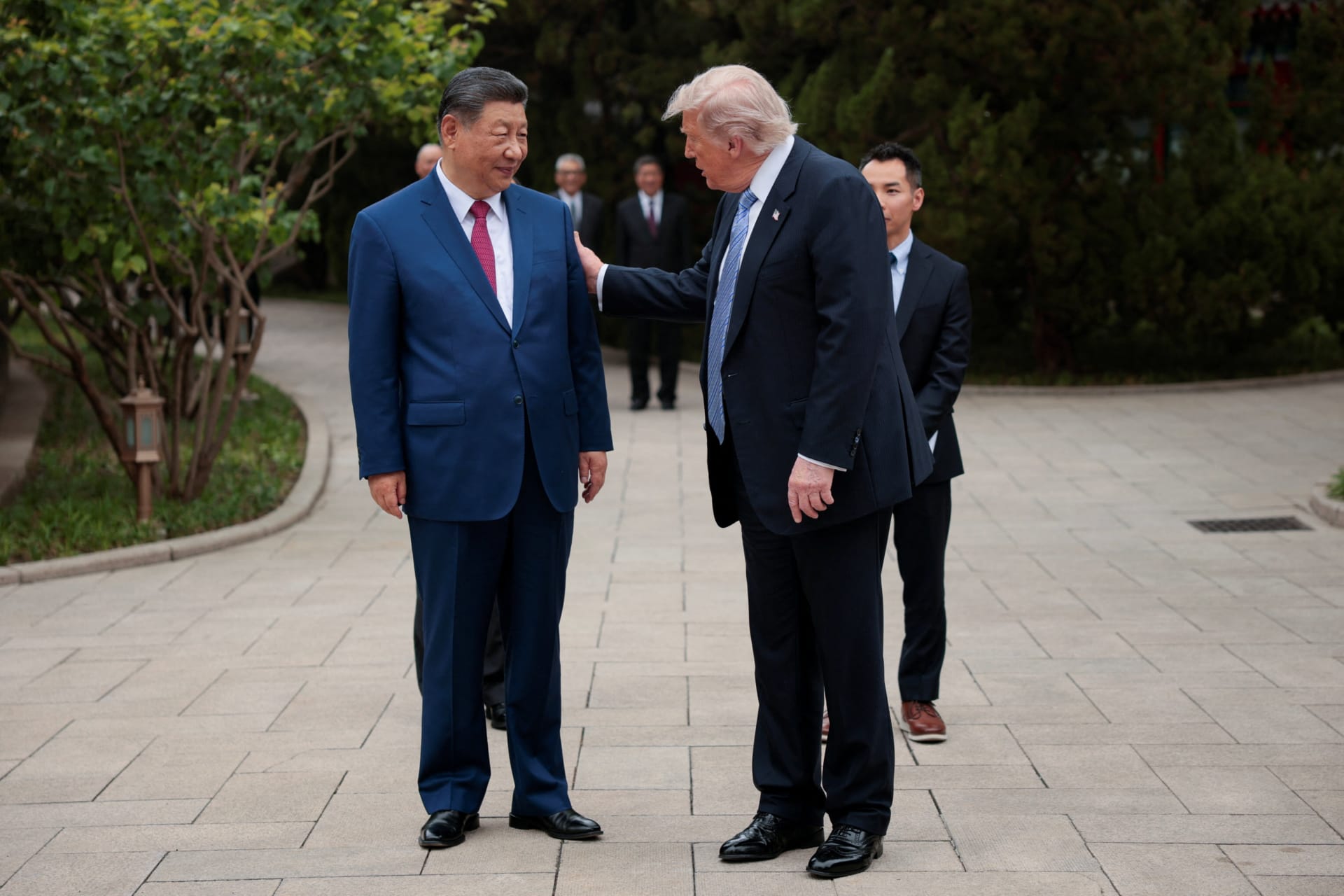 <p>U.S. President Donald Trump speaks with Chinese President Xi Jinping while leaving after a visit to the Zhongnanhai Garden in Beijing, China, May 15, 2026.</p>
