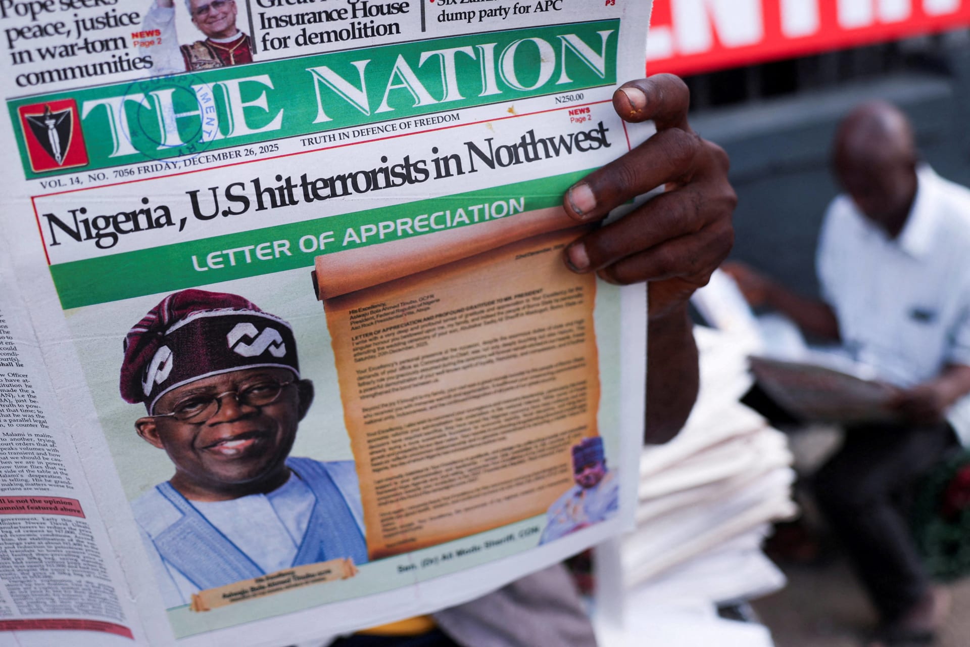 <p>People read newspapers reporting on U.S. airstrikes against Islamic State militants in Nigeria, according to U.S. President Donald Trump and the U.S. military, in Lagos, Nigeria, on December 26, 2025. </p>