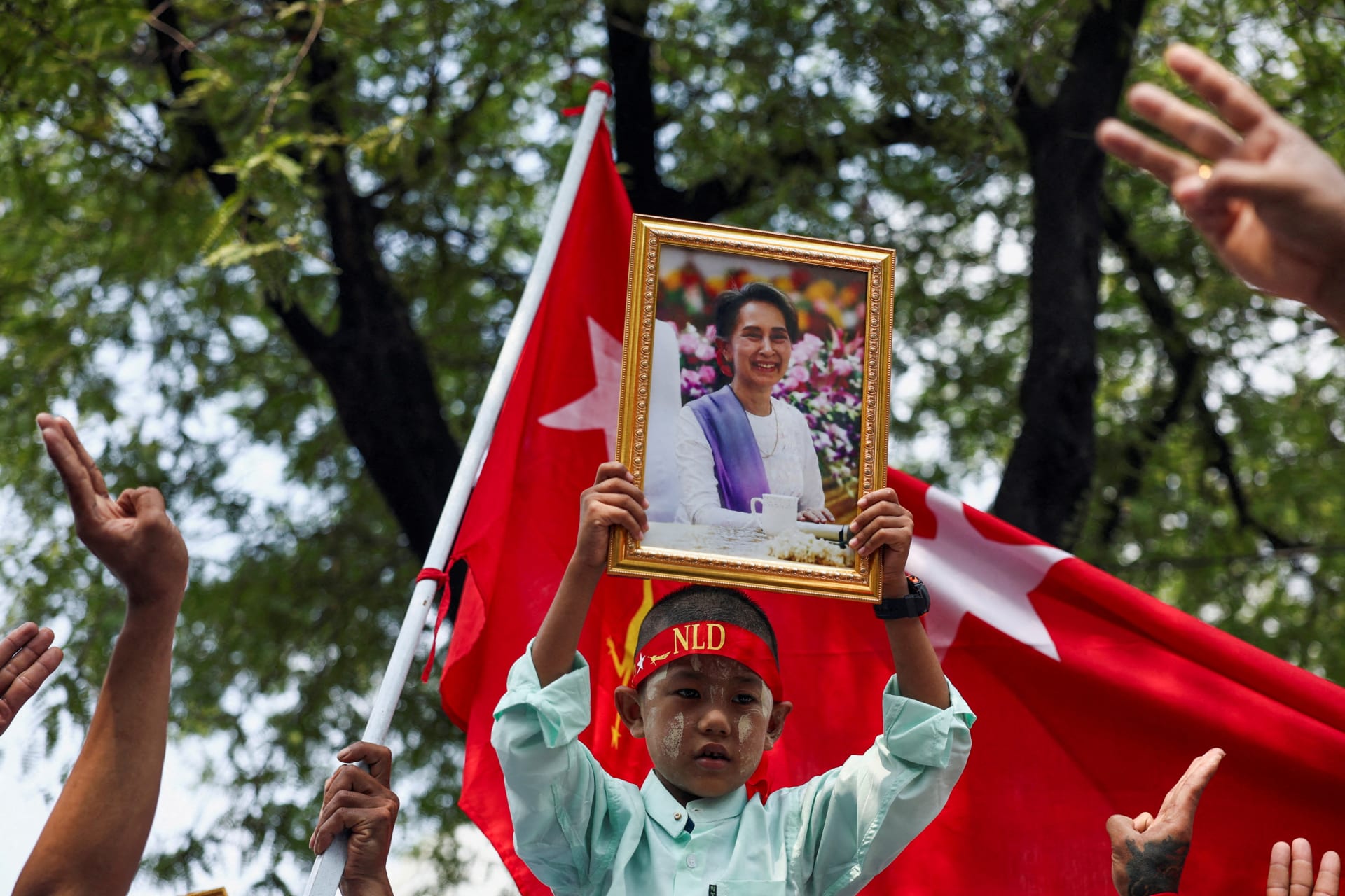 <p>A protester holds up a portrait of Aung San Suu Kyi during a demonstration outside of the United Nations office in Bangkok, Thailand on February 1, 2024 to mark the third anniversary of Myanmar’s 2021 military coup.</p>