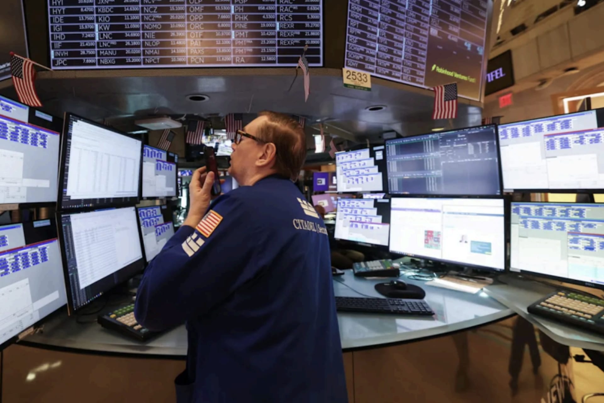 <p>A trader works on the floor of the New York Stock Exchange. Markets appear to have been comforted by the fact that truly catastrophic policies have been walked back.</p>

