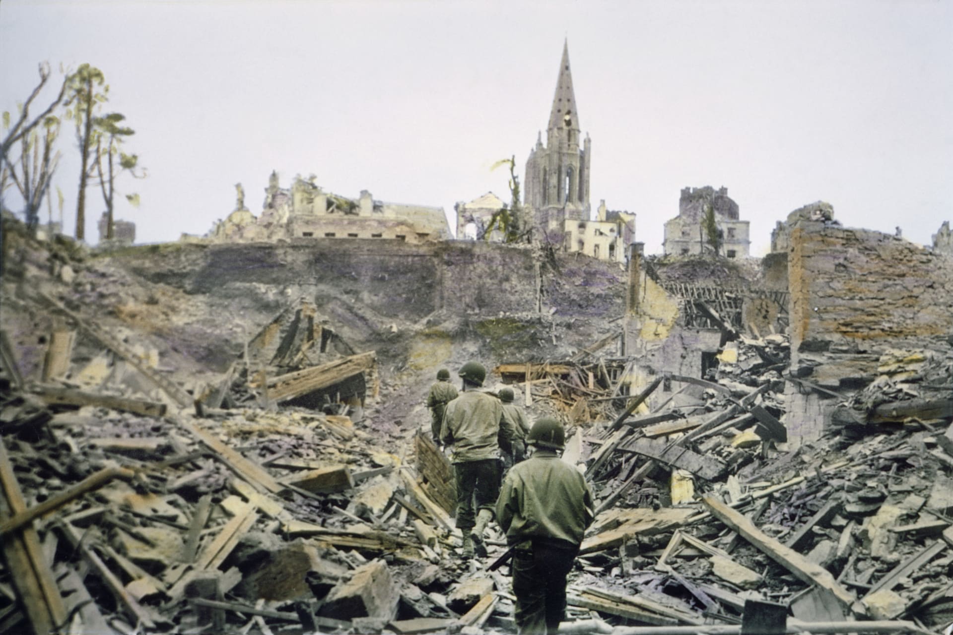 GETTY-1177468181-American-Infrantry-Patrol-Walks-Ruins-Of-French-Town.jpg