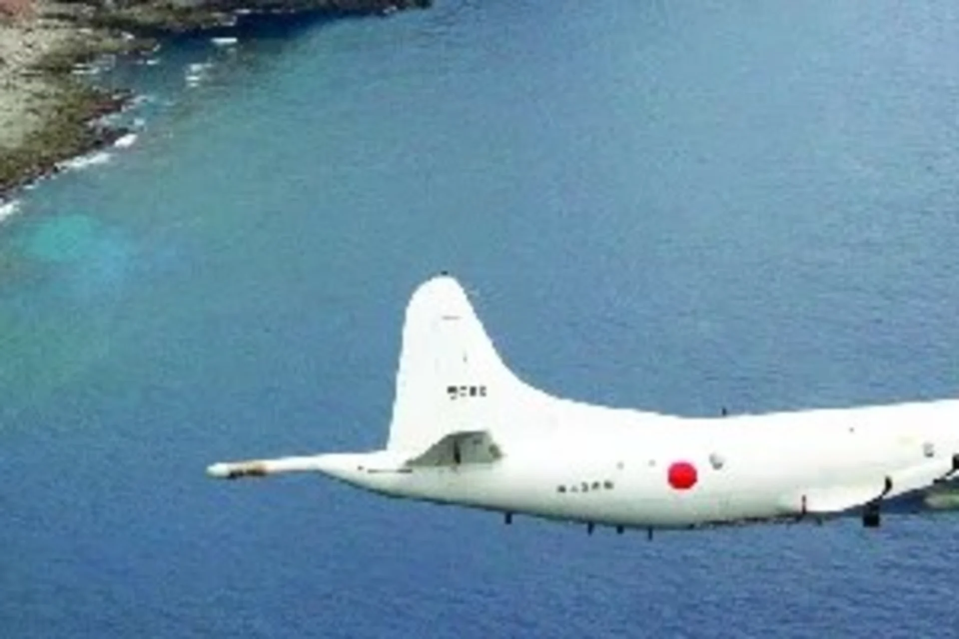 A sea plane flying over the East China Sea