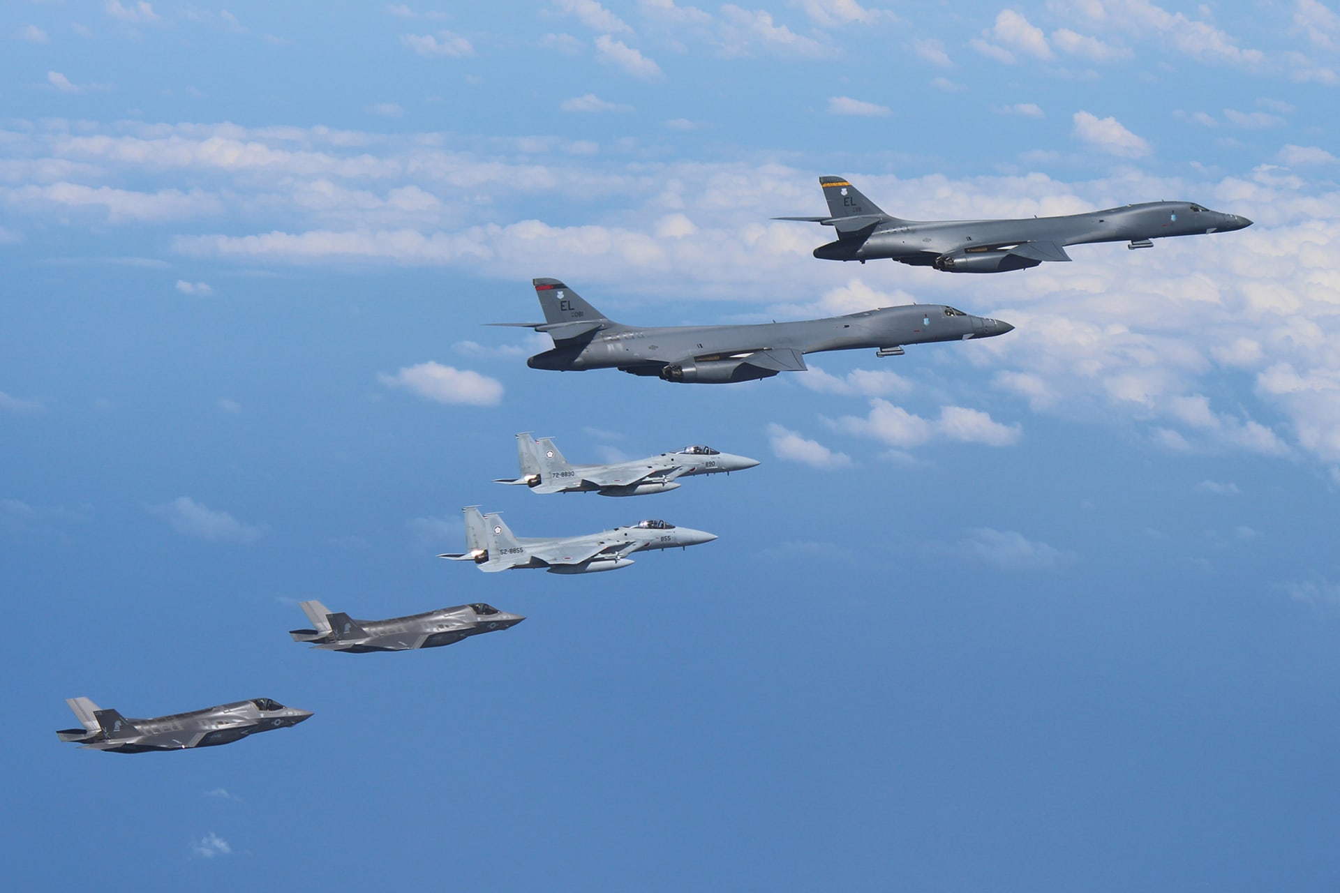 <p>Two U.S. Air Force B-1B Lancer bombers fly from Andersen Air Force Base, Guam, for a mission, with an escort of a pair of Japan Self-Defense Forces F-15 fighter jets and U.S. Marines’ F-35B fighter jets in the vicinity of Kyushu, Japan, in this photo released by Air Staff Office of the Defense Ministry of Japan August 31, 2017.</p>
