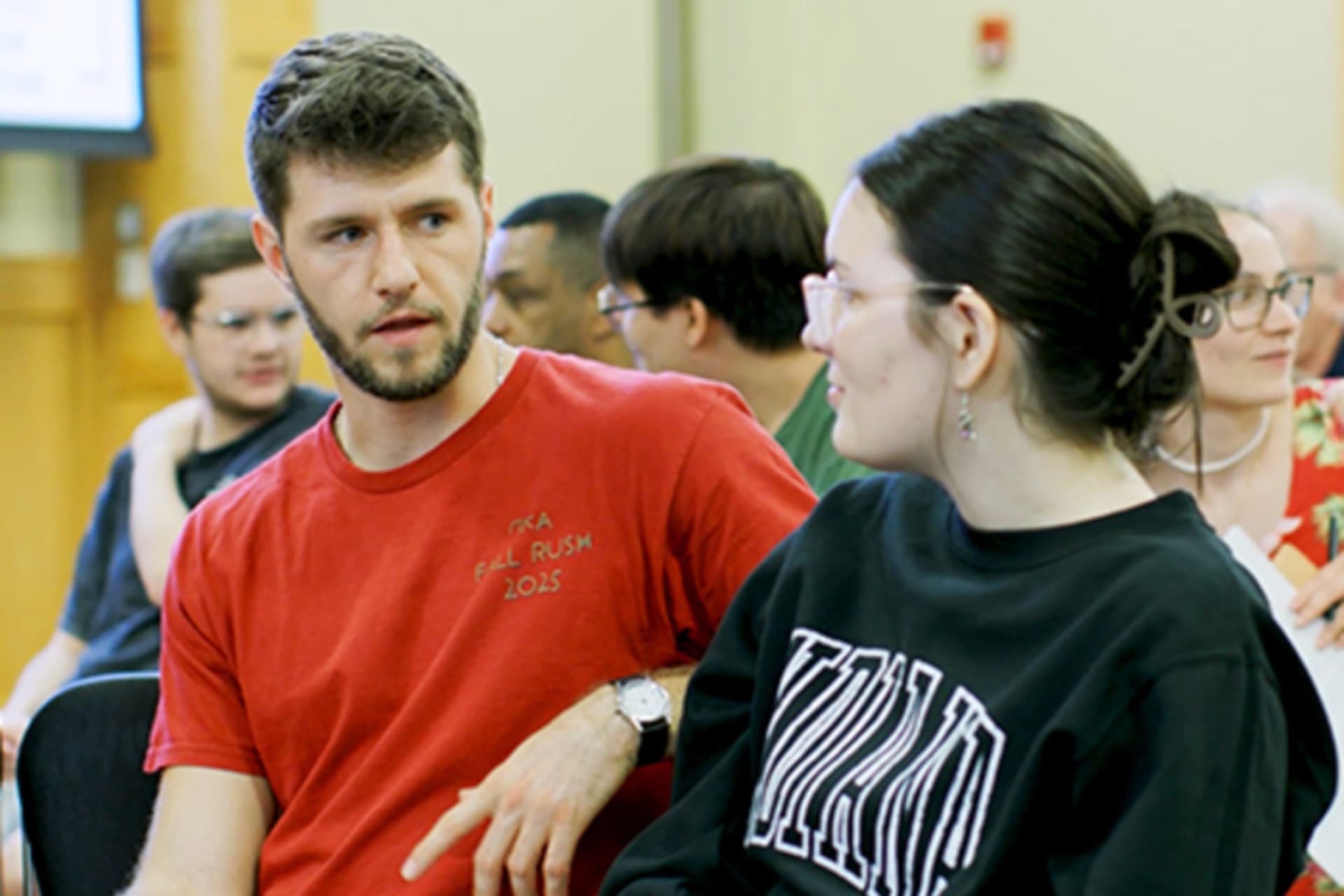 Students in a discussion at a college campus