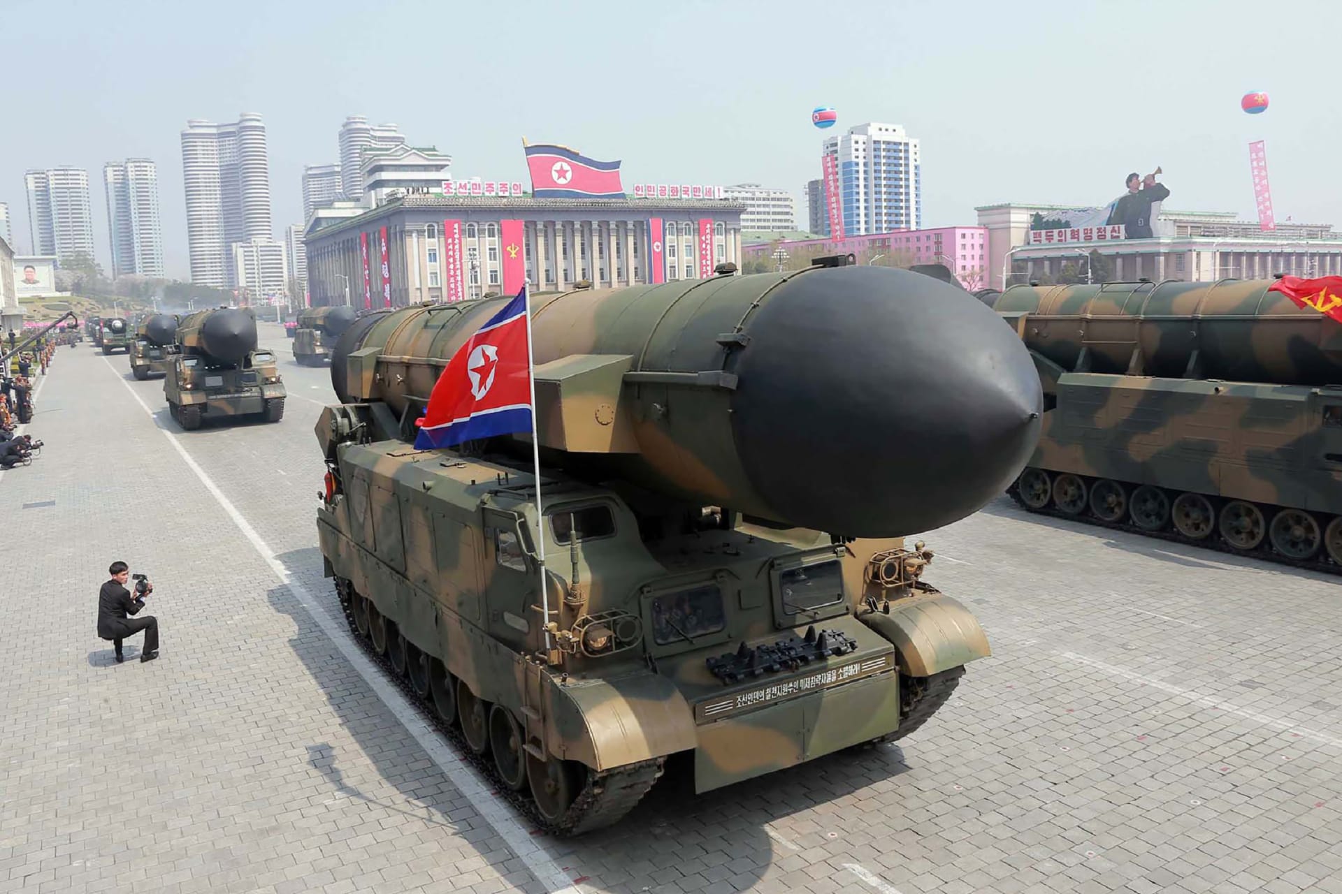 A missile is driven through a square during a military parade in North Korea.
