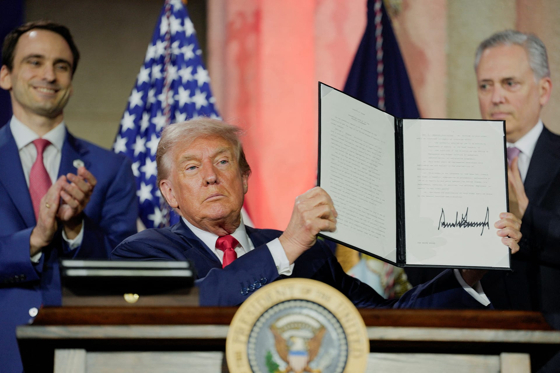 <p>U.S. President Donald Trump holds up a signed executive order related to AI during the “Winning the AI Race” summit in Washington, DC, on July 23, 2025.</p>