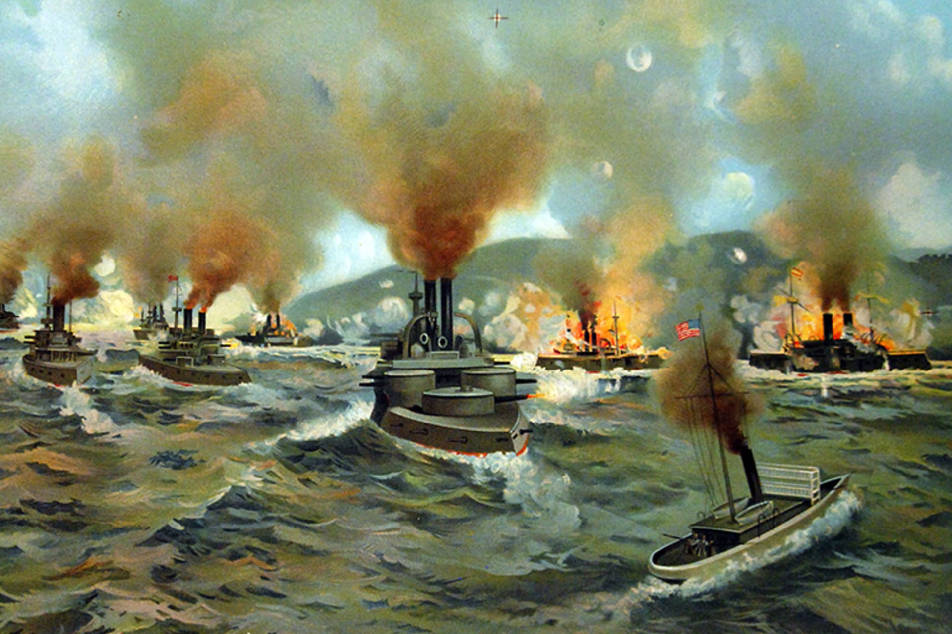 A painting of the naval Battle of Santiago de Cuba. Multiple ships are pictured, with some hit with fire.