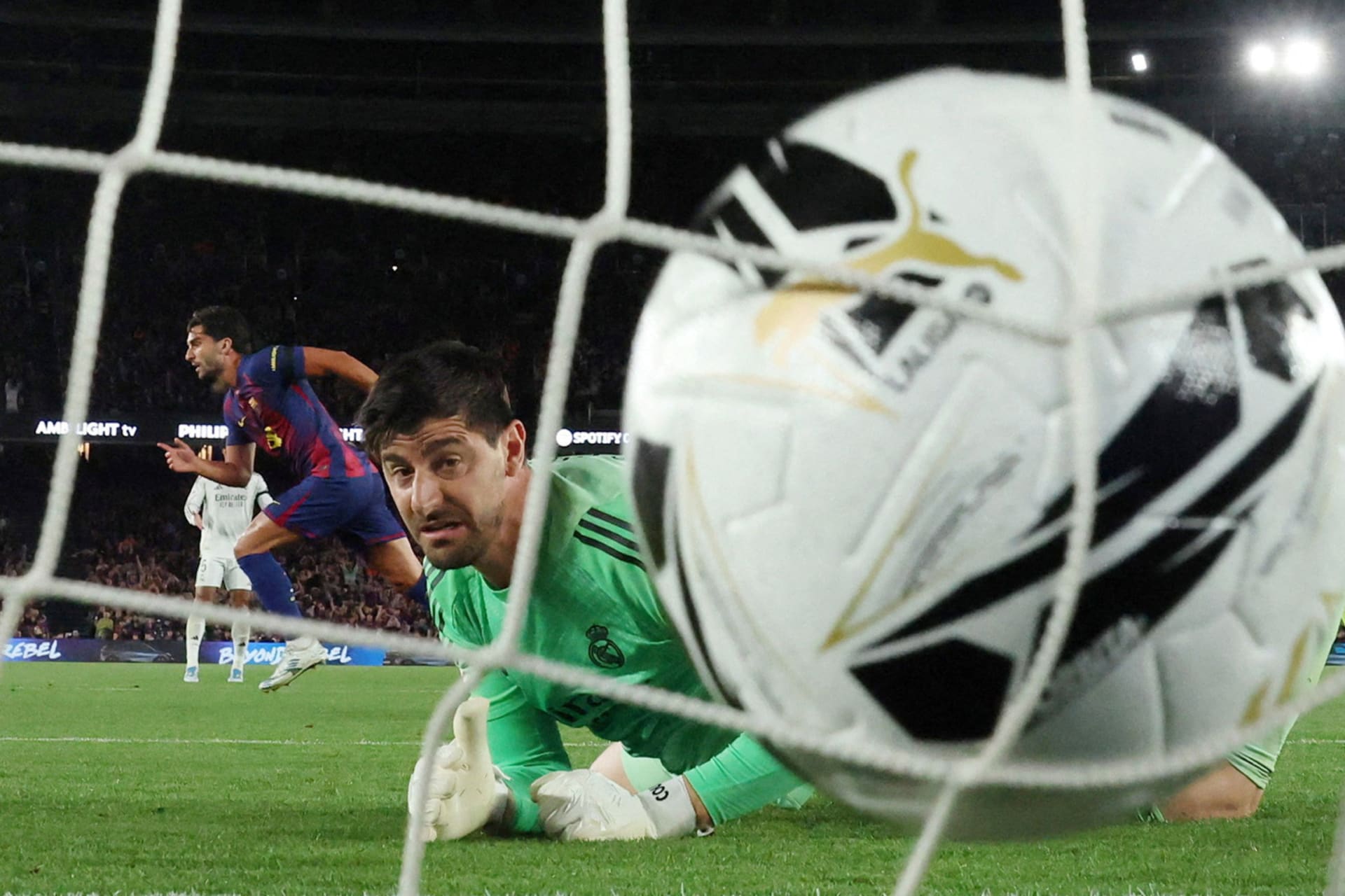 Soccer ball scores in goal.