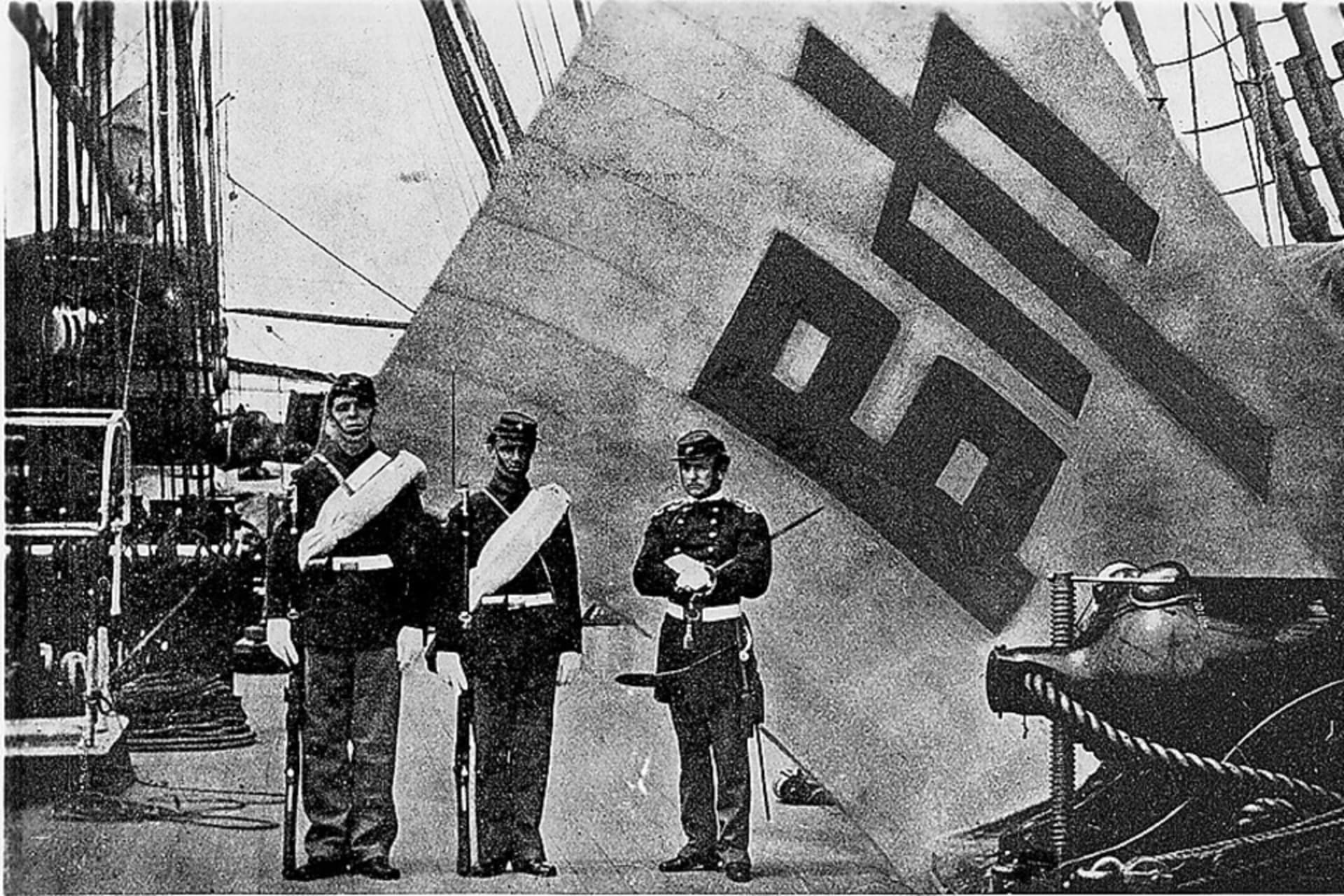 <p>The Sujagi (commanding) flag of Korean General Eo Jae-yeon, commander of the Ganghwa Island garrison, displayed on the USS Colardo, with Corporal Charles Brown, Private Hugh Purvis, and Captain McLane Tilton standing at attention, June 1871.</p>
