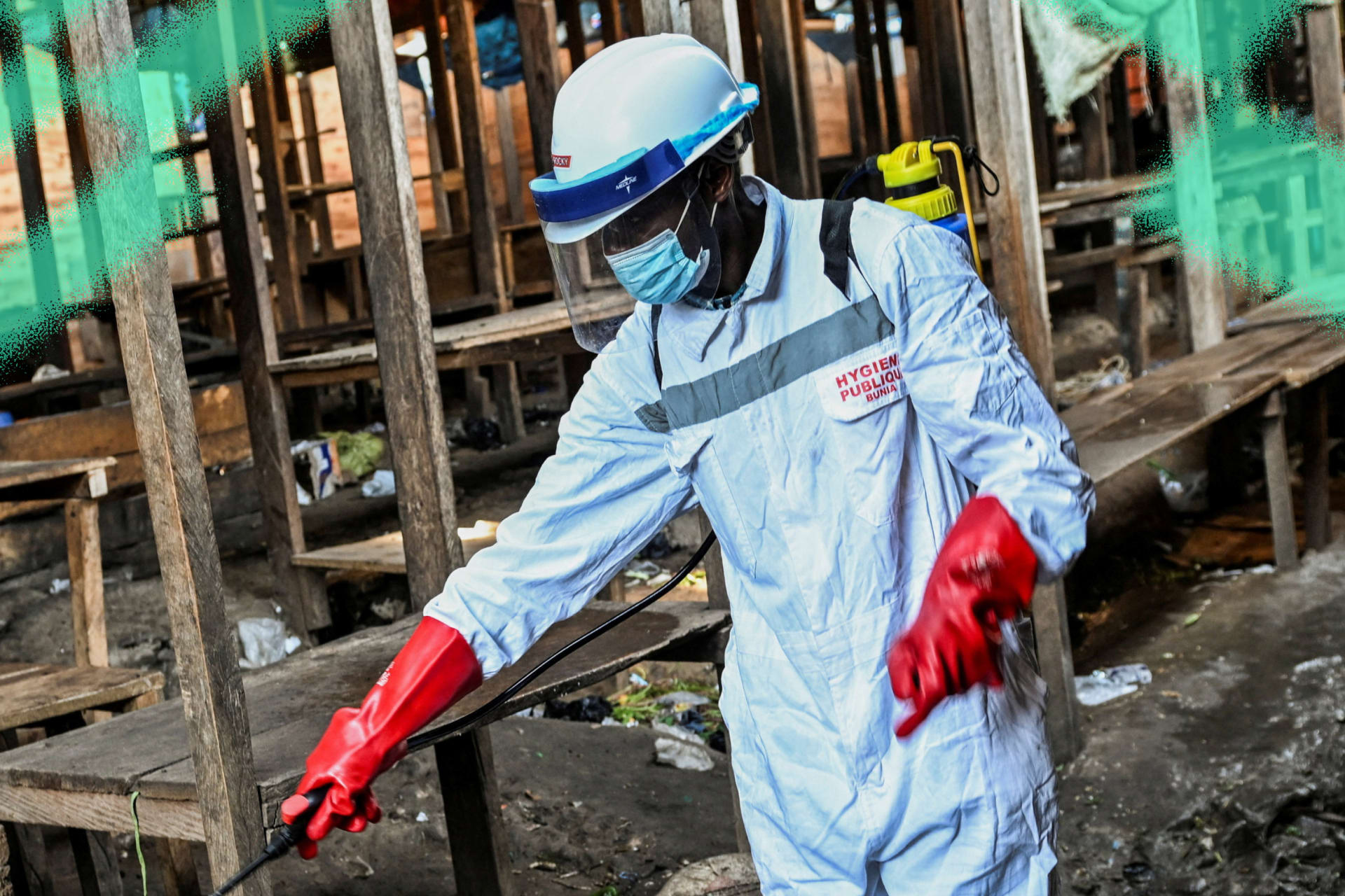 A sanitation worker from the Bunia city government sprays chlorine at the central market to limit the risk of the spread of the Ebola virus, in Ituri province, Democratic Republic of Congo, on May 23, 2026.