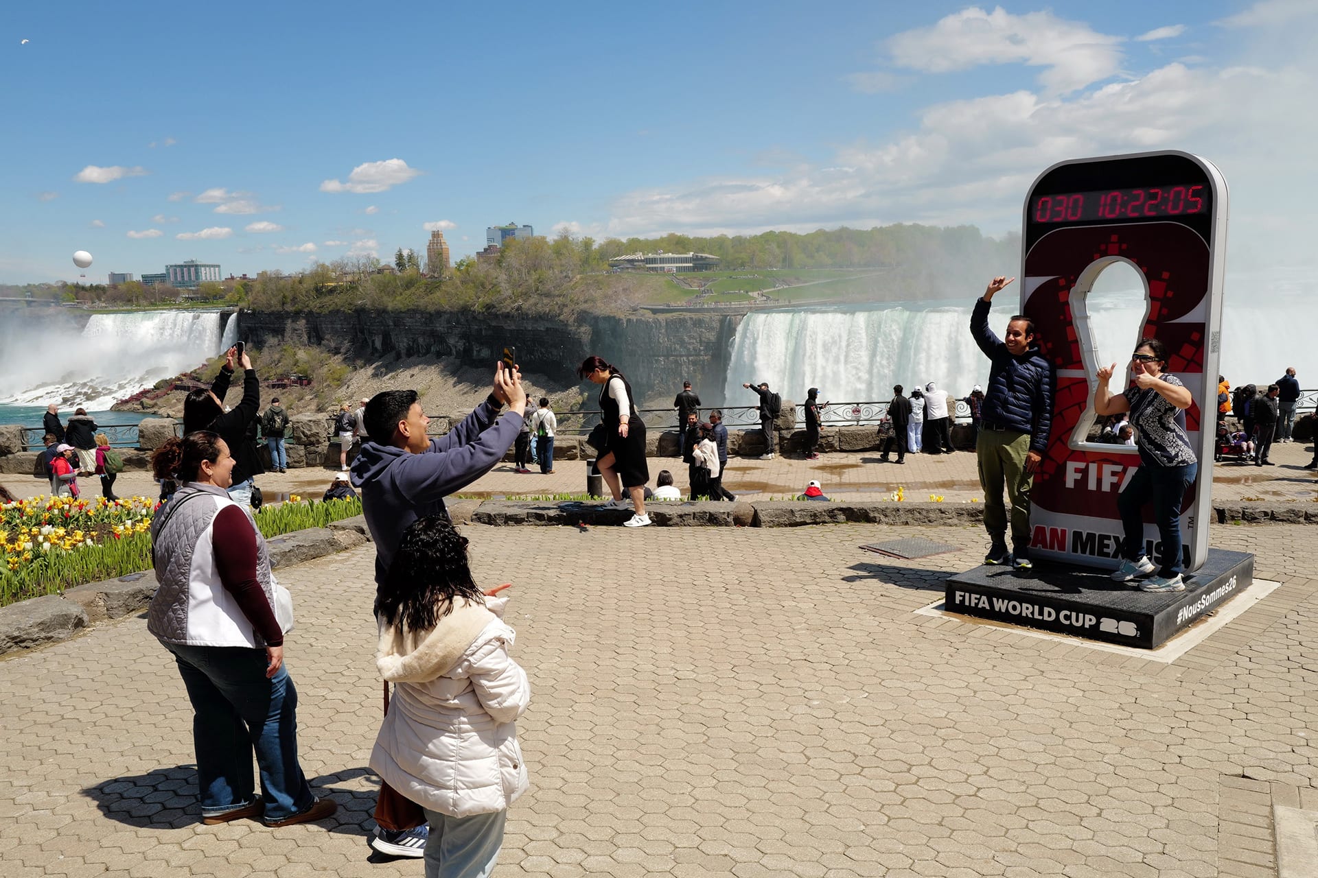 <p>People take photos in front of an official FIFA World Cup 2026 countdown clock at Niagara Falls, Ontario, Canada, May 11, 2026. </p>
