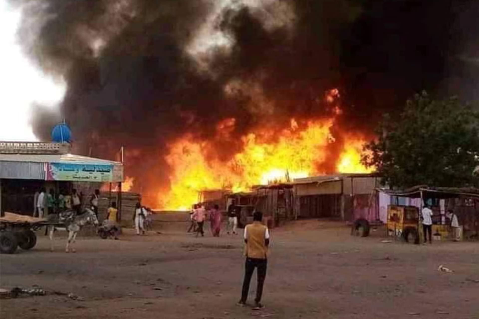 Fire destroys a livestock market in El Fasher, in Sudan’s North Darfur state, in September 2023 after an attack by the Rapid Support Forces.