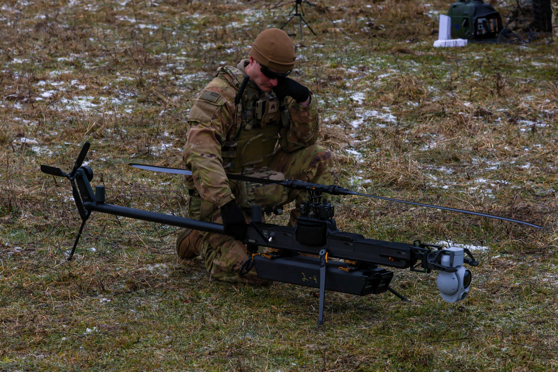 A U.S. soldier prepares the Anduril Ghost-X Medium-Range Reconnaissance (MRR) drone for flight, in Hohenfels