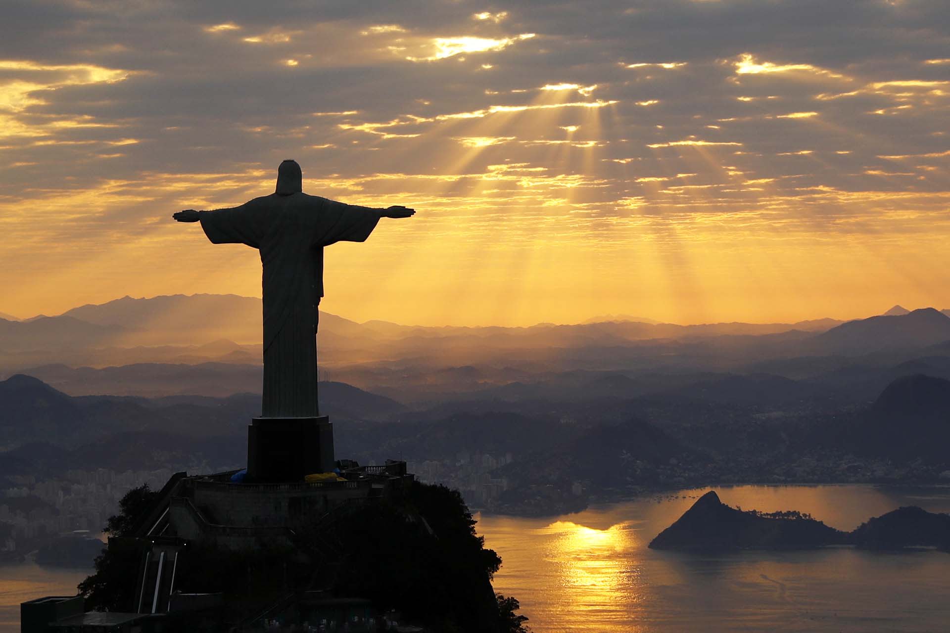 Christ The Redeemer is seen during sunrise in Rio de Janeiro