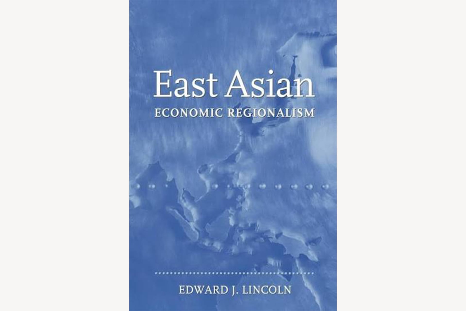 A light blue book cover with a map of East Asia in the background with text that reads, "East Asian Economic Regionalism".