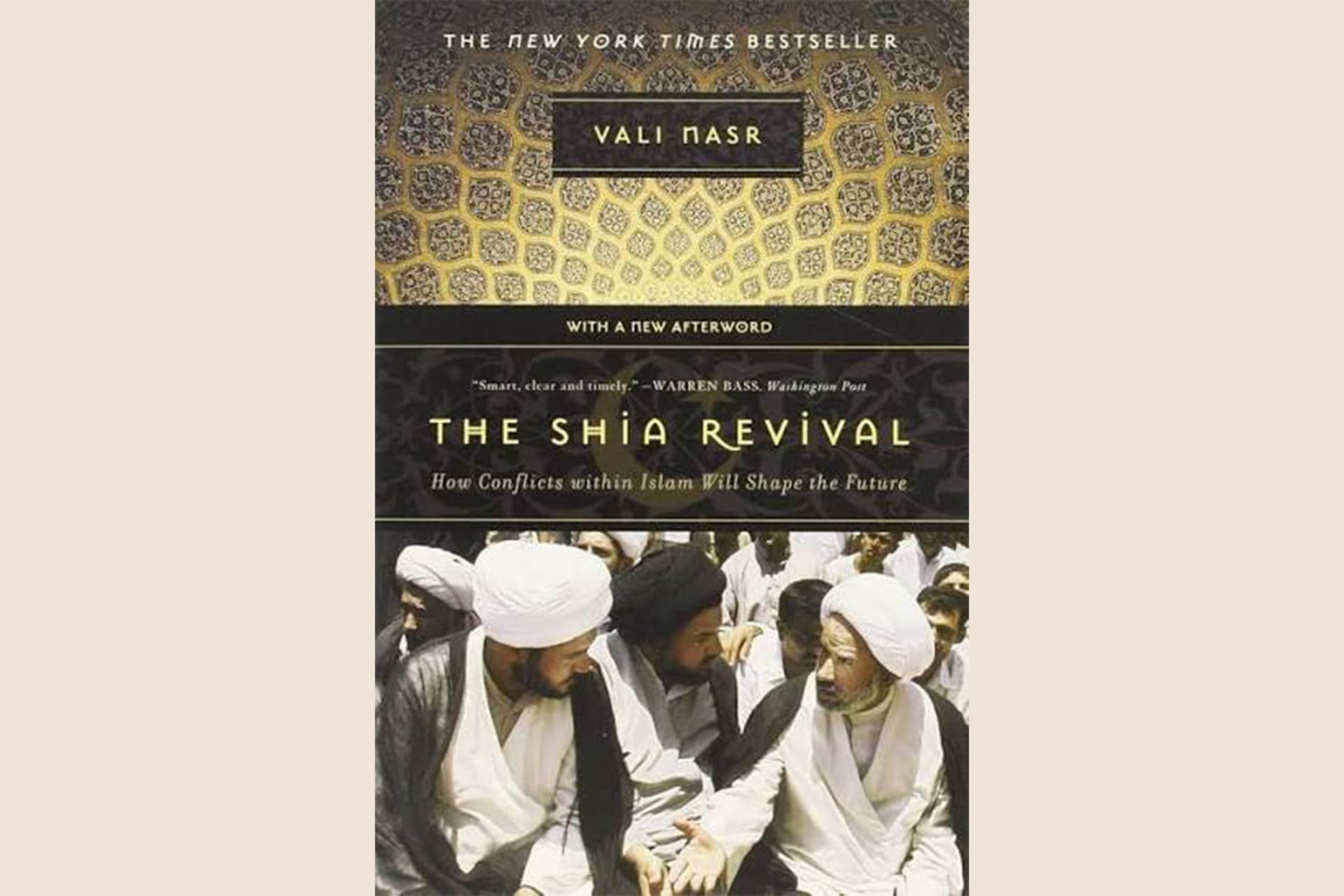 A book cover with an intricate design on the top half and a photo of Muslim men talking on the bottom half. The text reads, "The Shia Revival: How Conflicts within Islam Will Shape the Future".