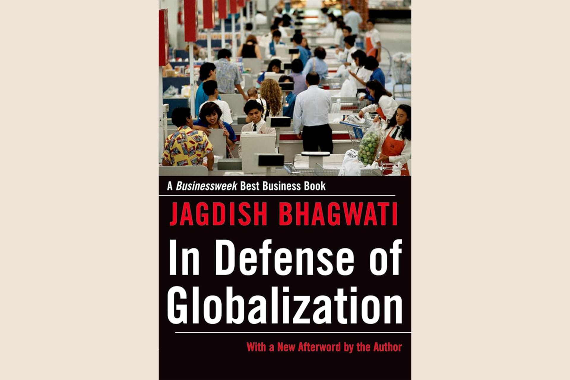 A book cover with a photo of people working in an office on the top half and text on the bottom half that reads, "In Defense of Globalization".
