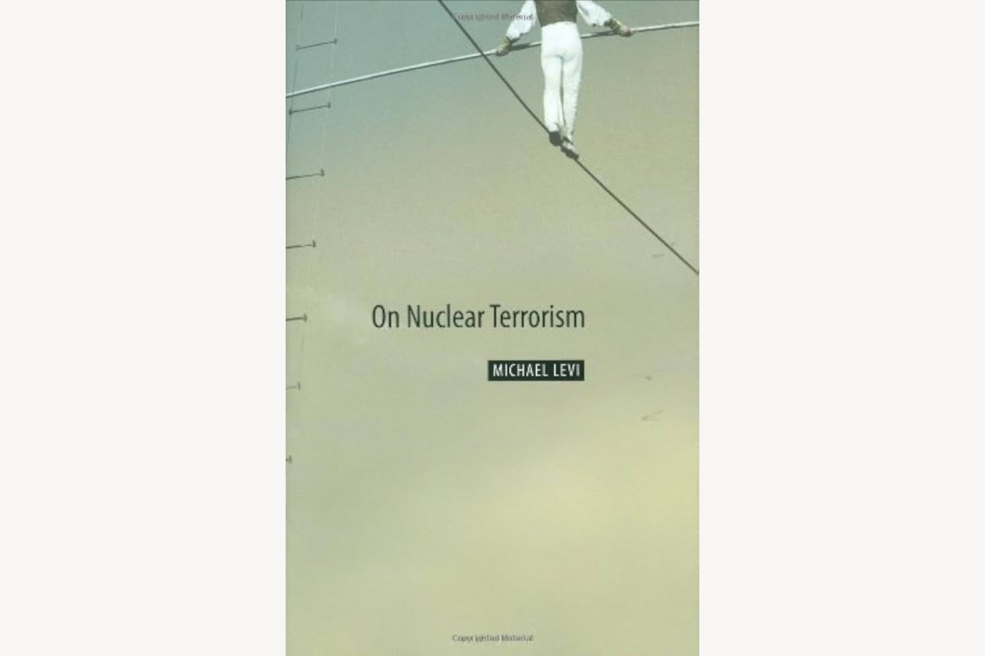 A book cover showing a person walking a tightrope and holding a rod in their hands. The text reads, "On Nuclear Terrorism".