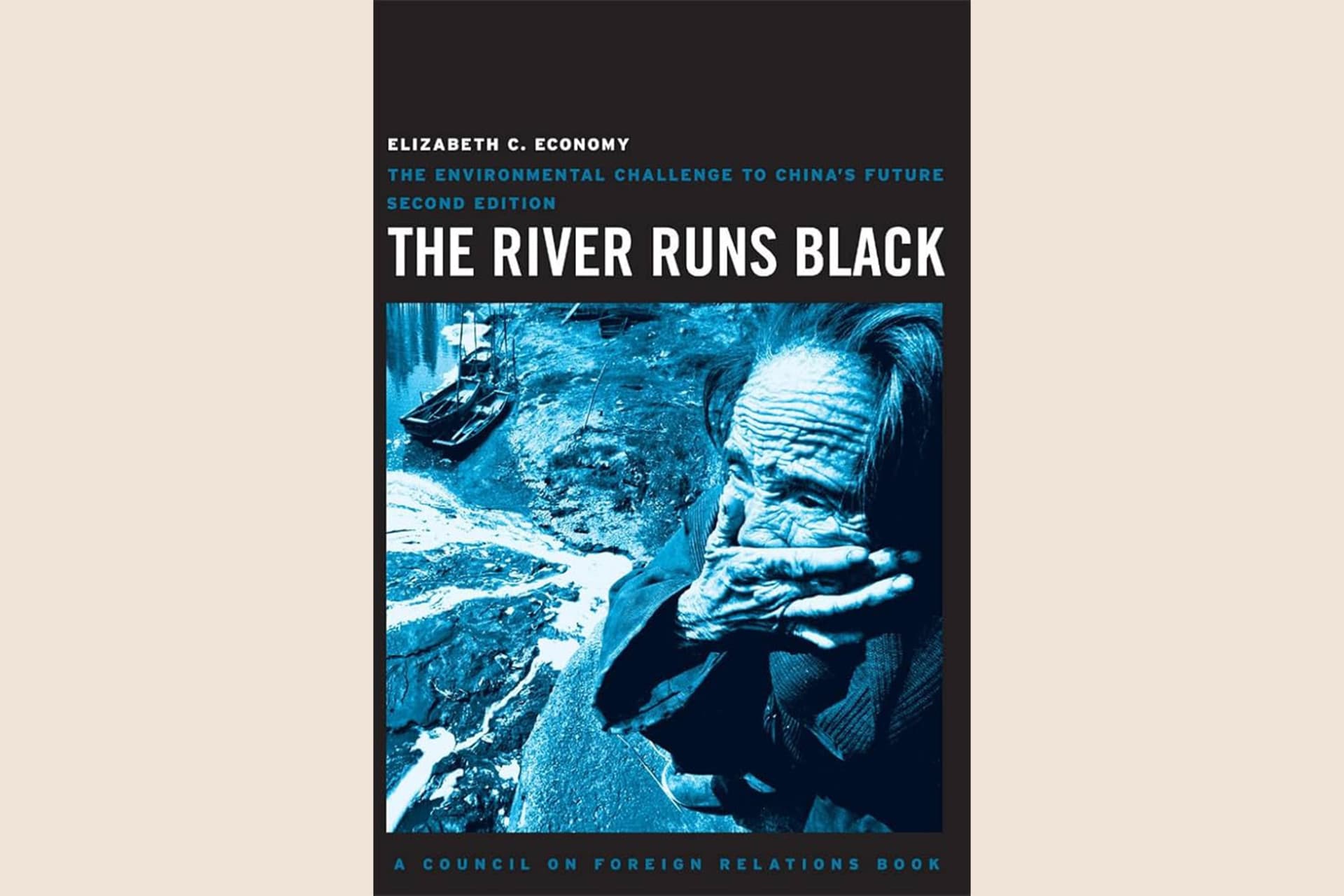 A book cover with a photograph of someone covering their mouth in a horrified manner next to a river. The photo has a dark, blueish filter over it. The text reads, "The River Runs Black: The Environmental Challenge to China's Future".