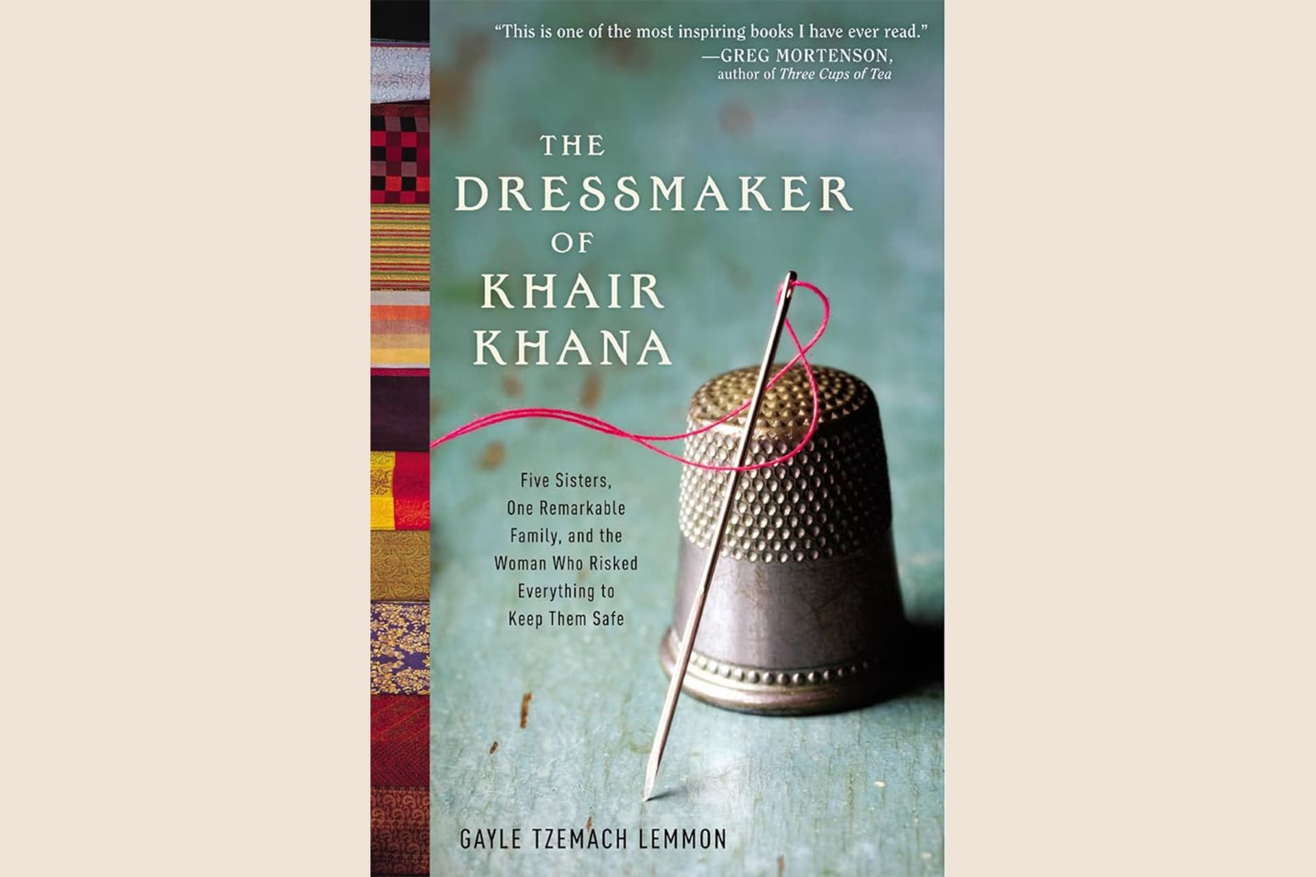 A book cover showing a thimble, needle, and thread with text that reads, "The Dressmaker of Khair Khana: Five Sisters, One Remarkable Family, and the Woman Who Risked Everything to Keep Them Safe".