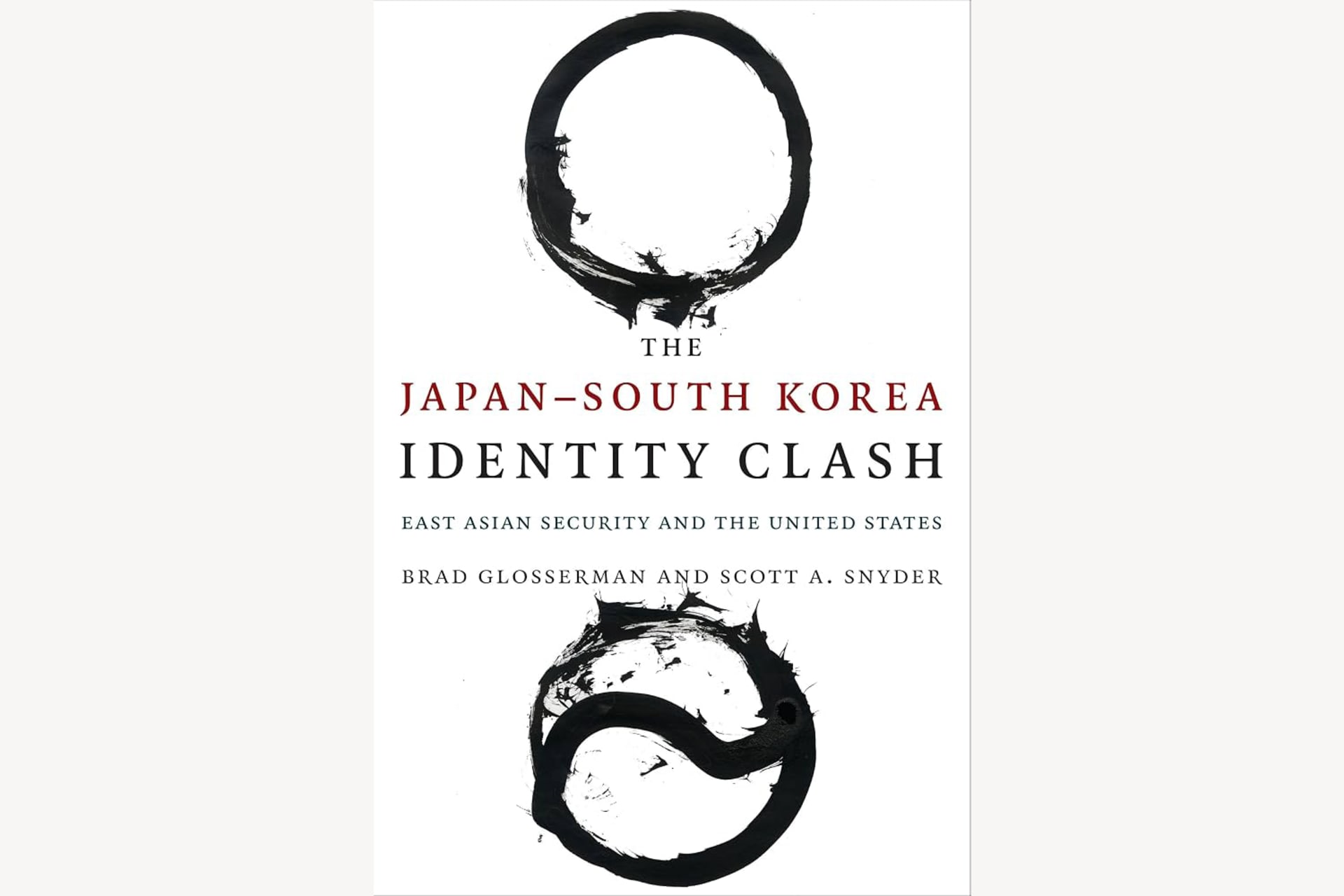 A book cover showing two dark rings above and below the title. The text reads, "The Japan-South Korea Identity Clash: East Asian Security and the United States".