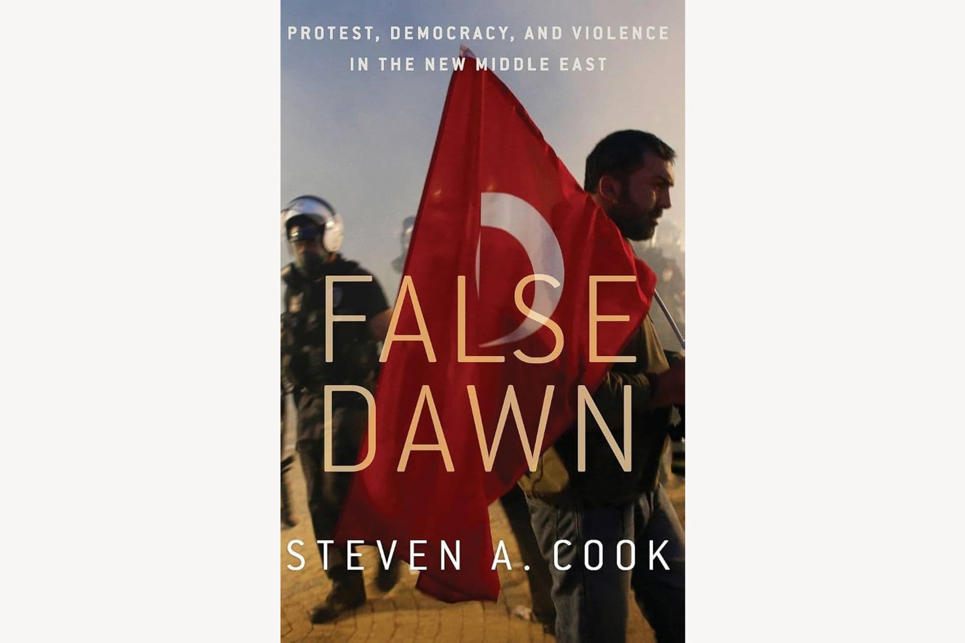 A book cover showing a man carrying a Turkish flag and a pilot behind him. The text reads, "False Dawn: Protest, Democracy, and Violence in the New Middle East".