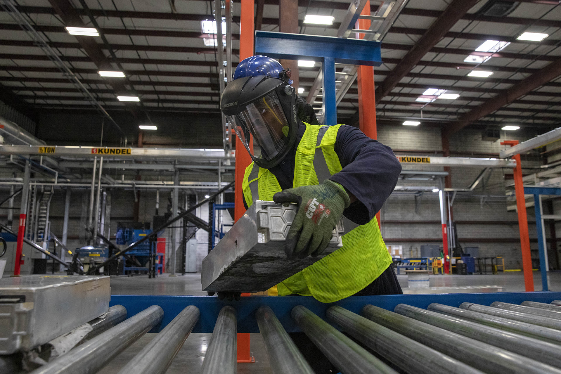 <p>A technician places electric vehicle batteries on a conveyer belt at the Ascend Elements electric vehicle recycling plant in Covington, Georgia, March 31, 2023. </p>
