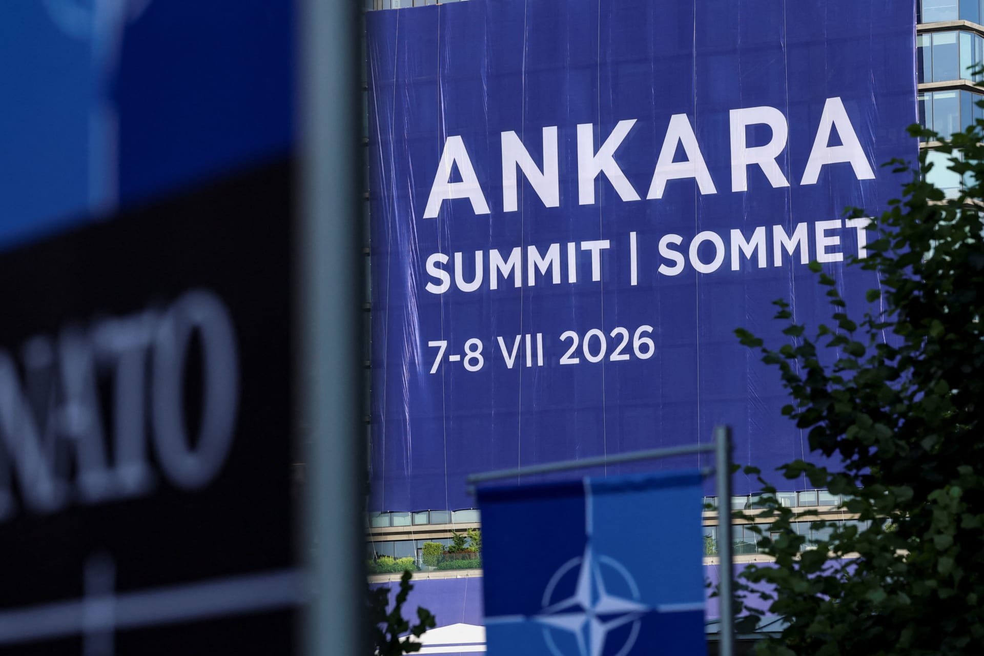 A banner hangs at the venue where the NATO leaders' summit is due to take place, in Ankara.
