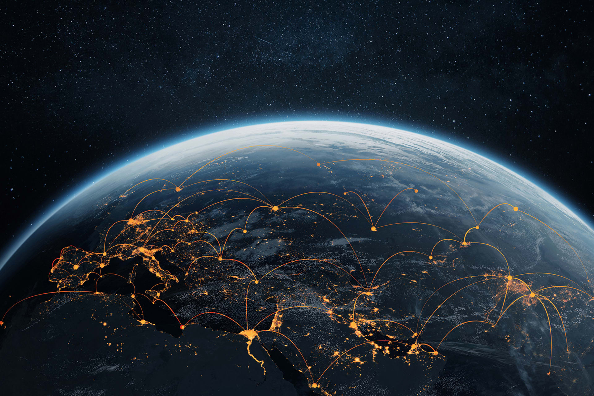A shot of Earth from space with bright lights connecting different parts of the world, representing interconnectedness.
