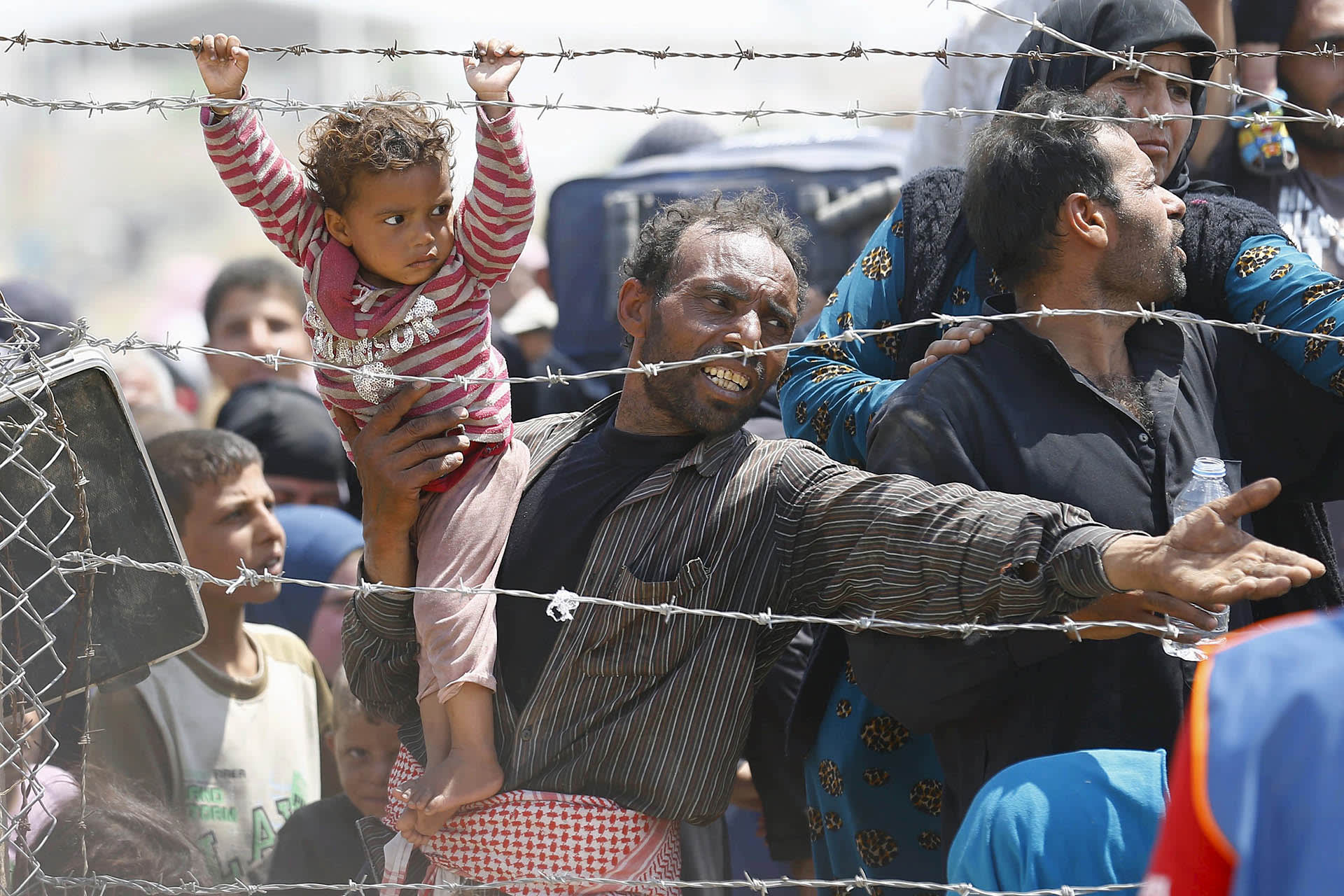 ATTENTION EDITORS: A Picture and Its Story: A Father Begs for Help