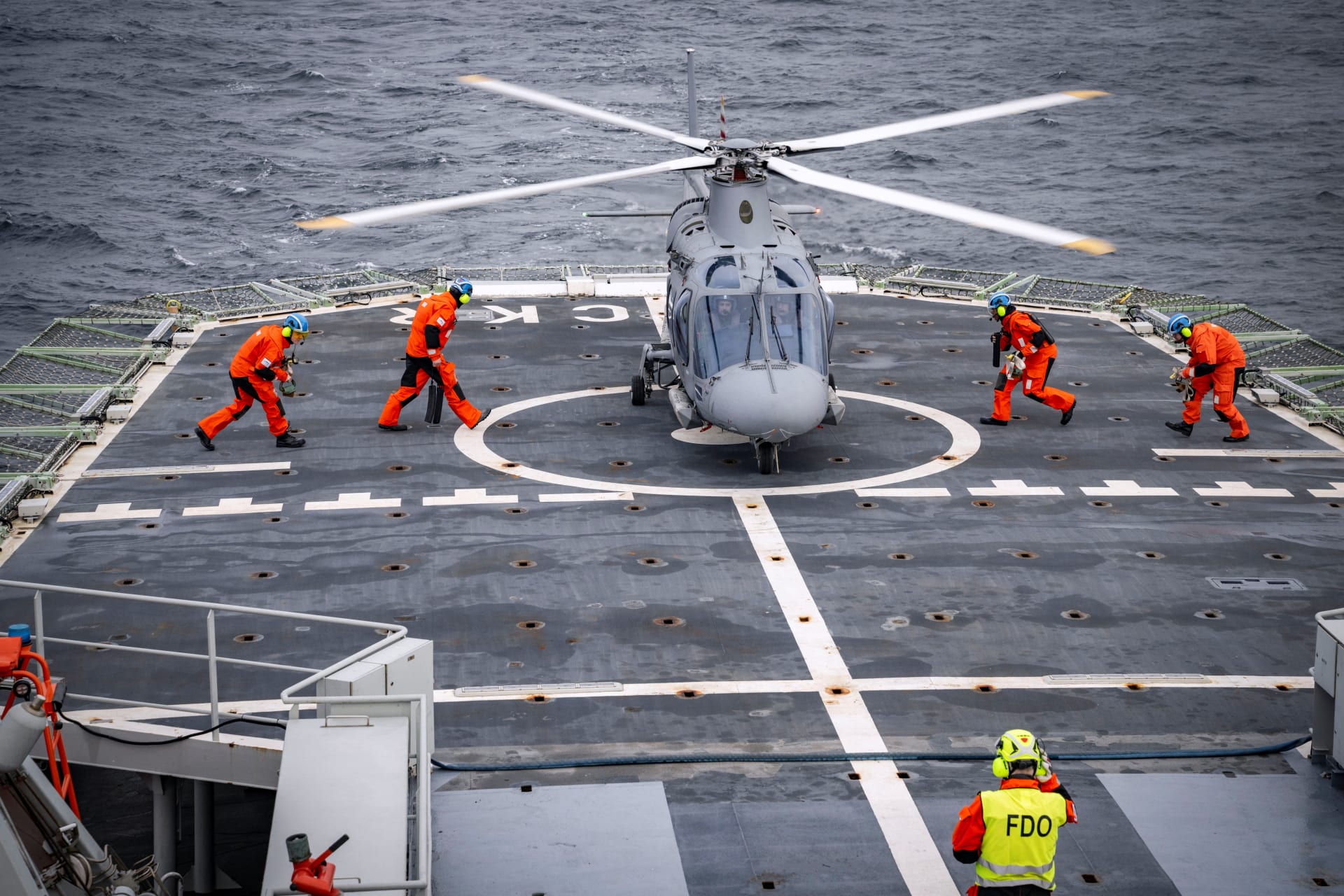 A helicopter lands on the flight deck of the patrol ship HSwMS Carlskrona after it set sail to join NATO’s Operation Baltic Sentry on February 4, 2025.