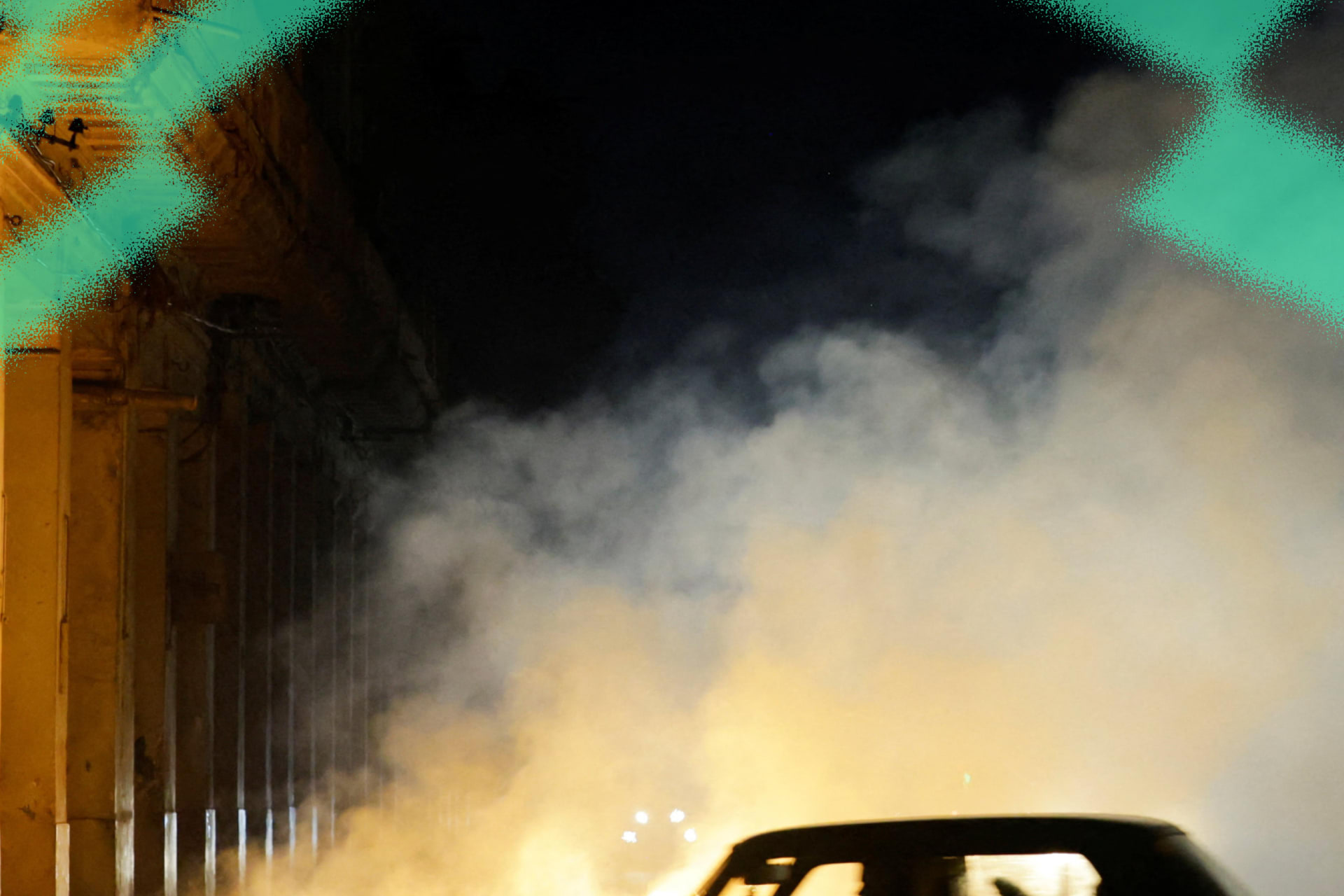A car drives past a burning pile of garbage in Havana, Cuba on July 14, 2026.