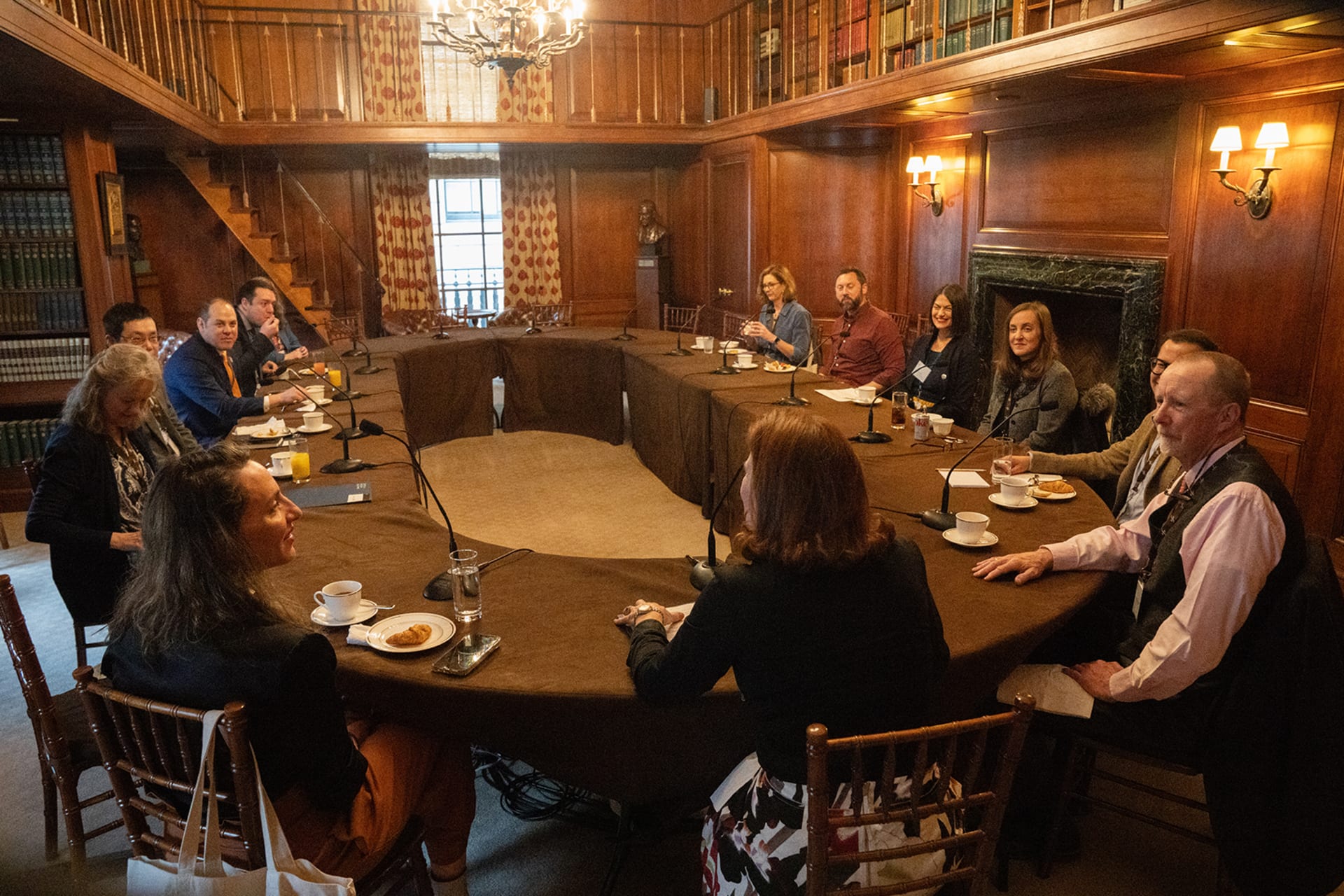 CFR Education Ambassadors sitting around a table in discussion.