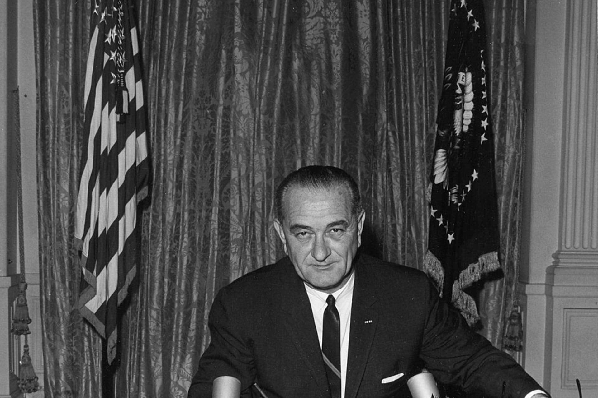 <p>President Lyndon B. Johnson signs the Gulf of Tonkin Resolution in the White House East Room, August 10, 1964.</p>