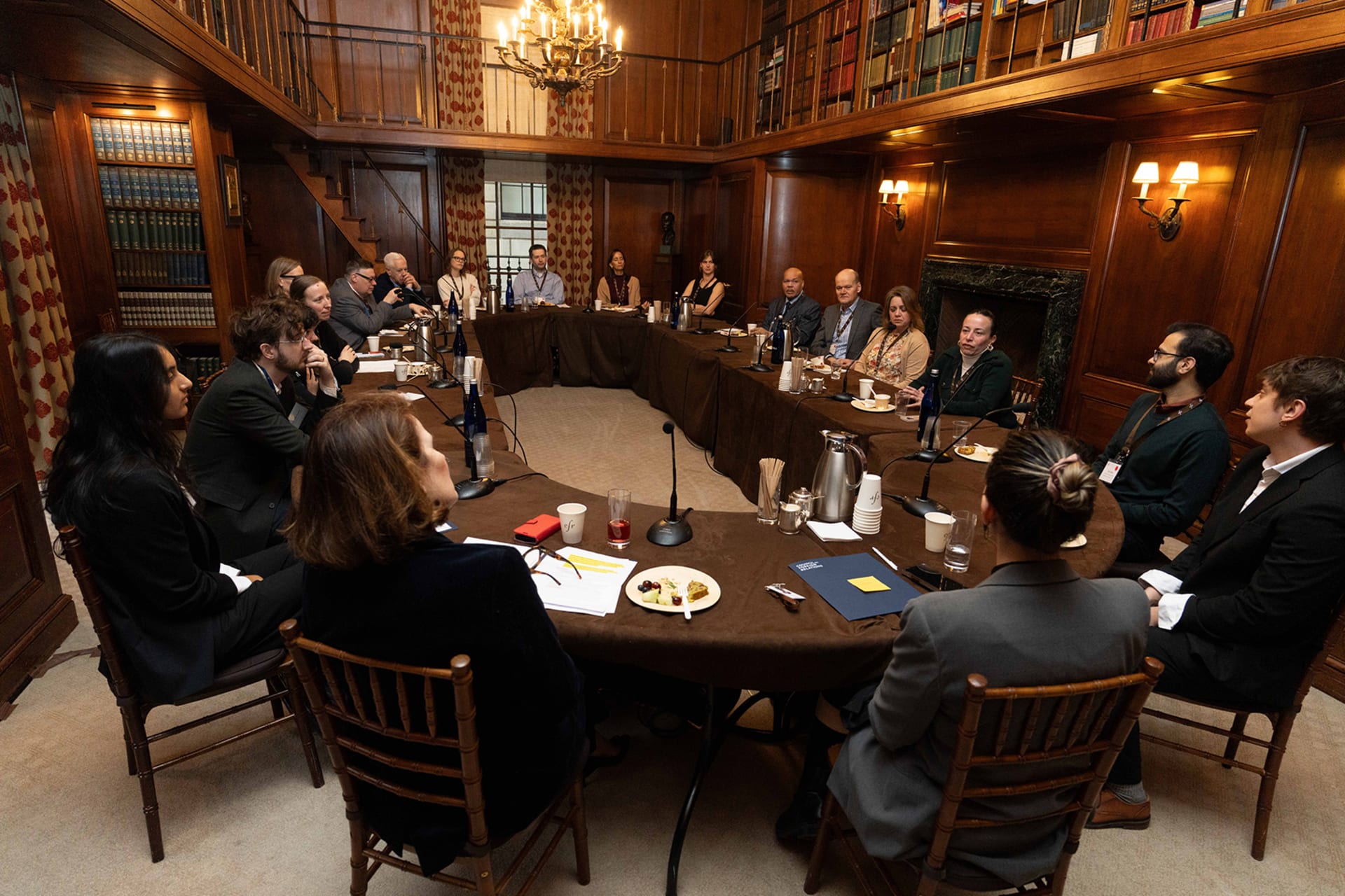 CFR Education Ambassadors sitting around a table in discussion.