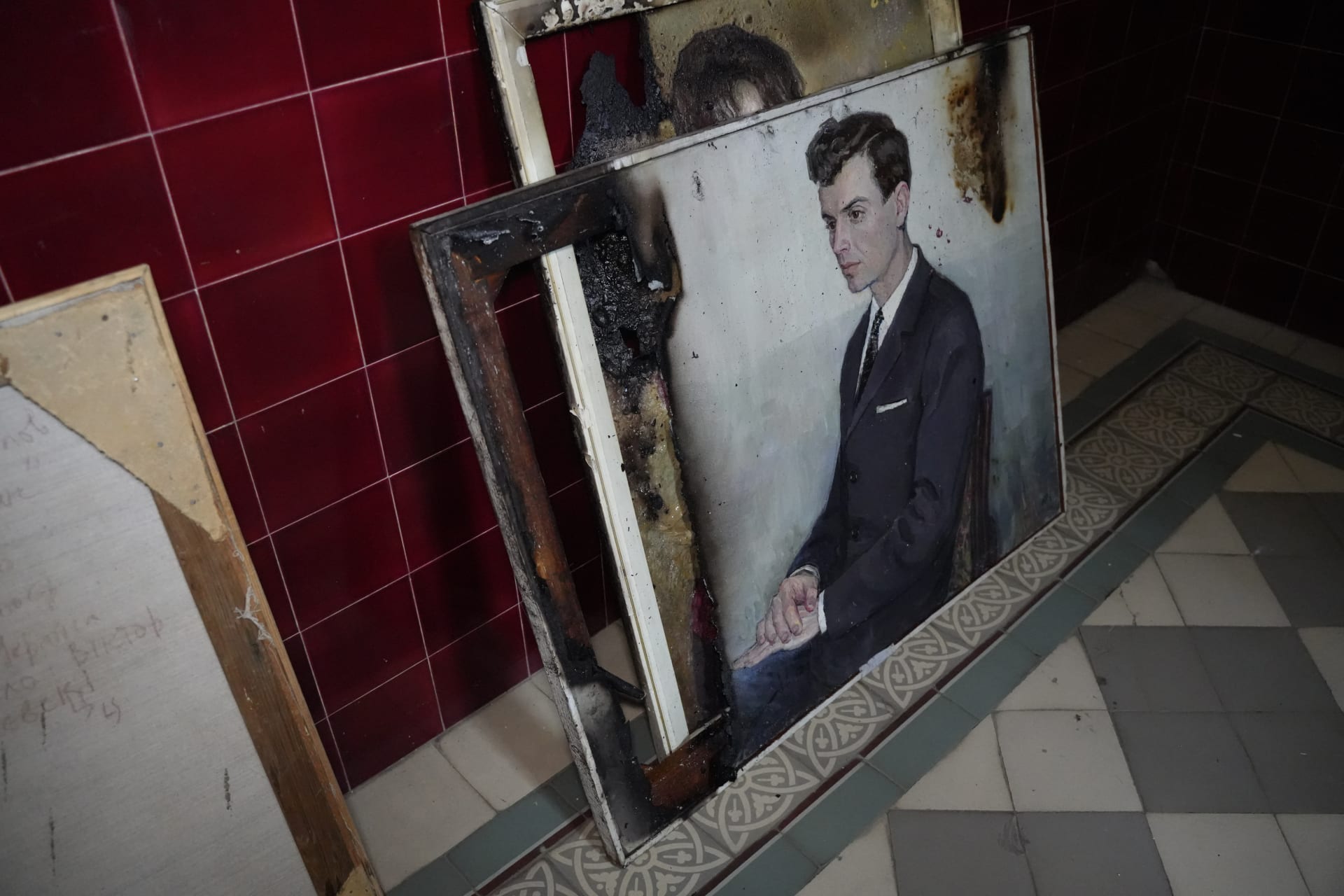 <p>Burned paintings rest on the floor inside the Kharkiv Art Museum after a Russian drone strike in June 2026.</p>