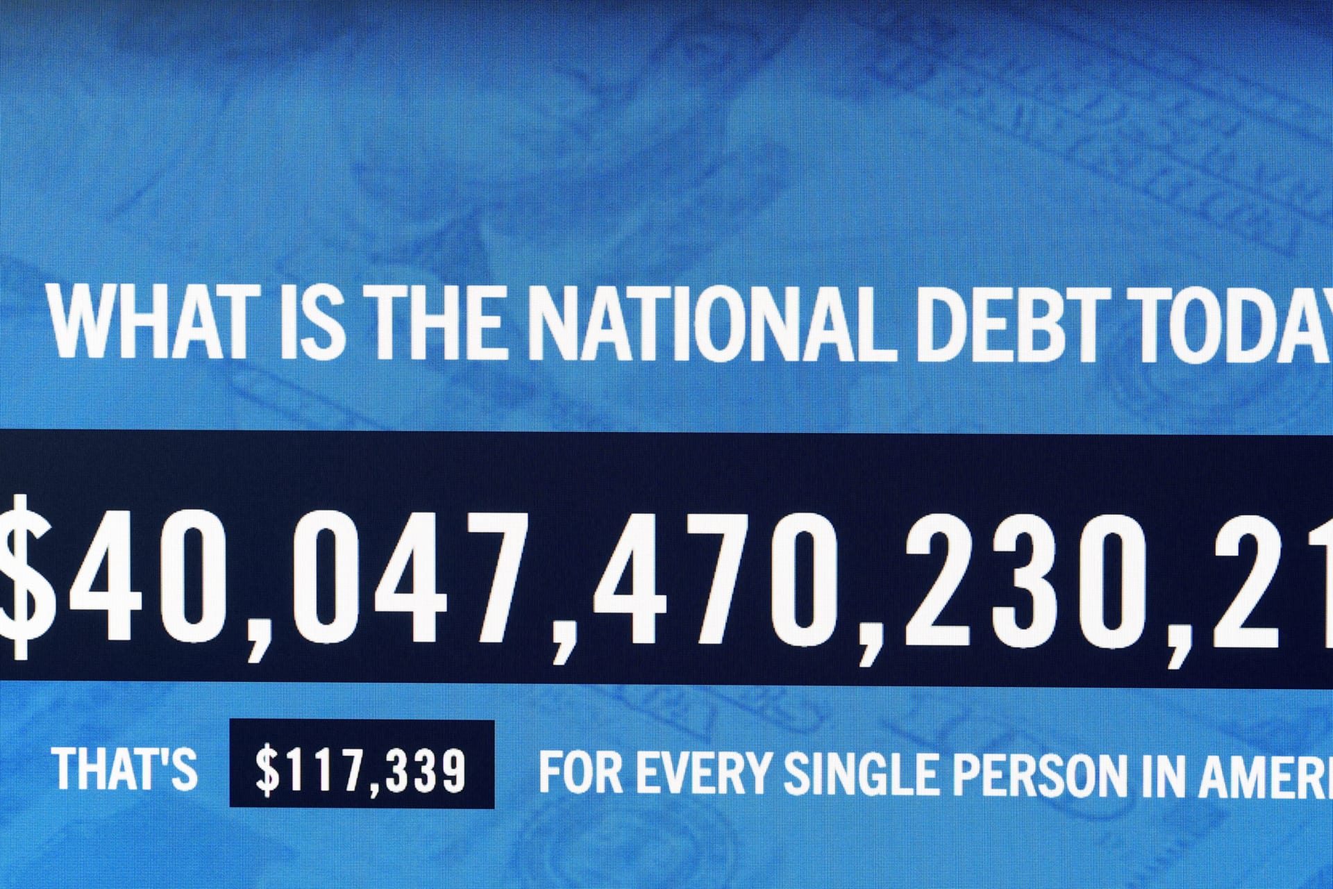 <p>A screen displaying the total U.S. national debt in New York City, August 19, 2026.</p>

