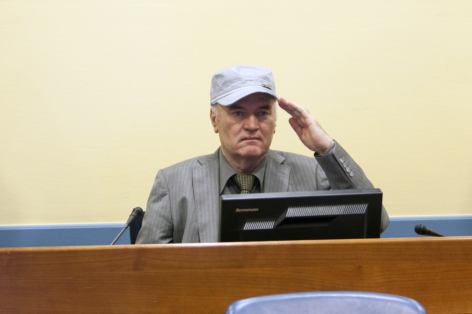 Ratko Mladić salutes as he makes his first appearance at the International Criminal Tribunal